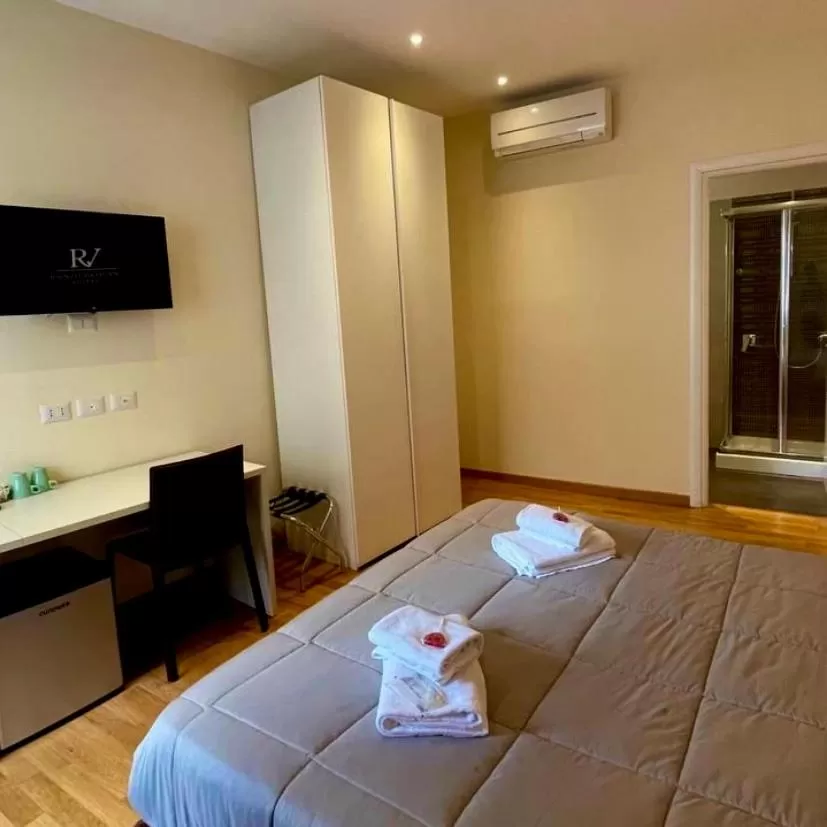 Bed in Rienzo Vatican Suites