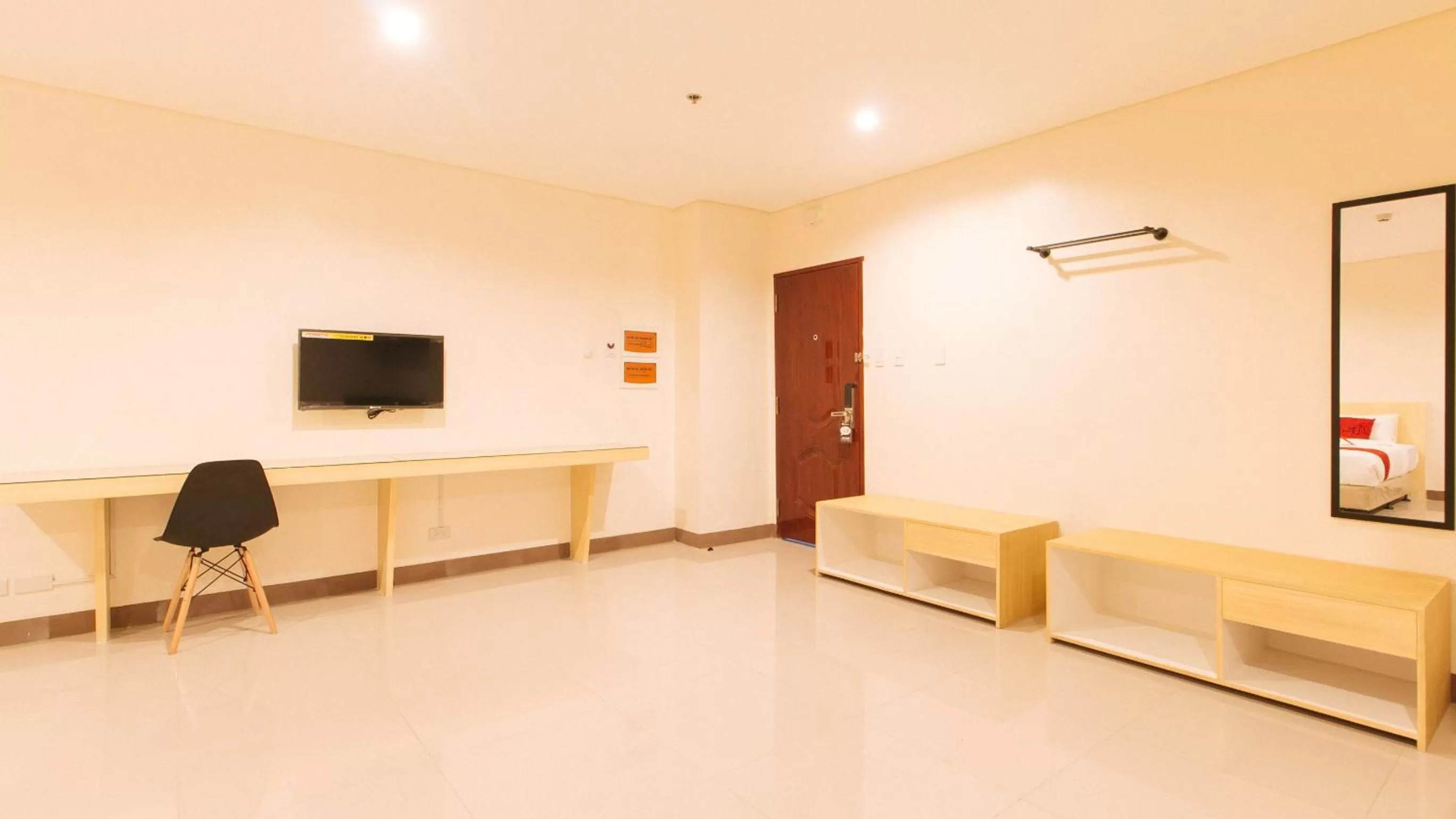Seating area, Bed in RedDoorz Plus @ Kaizen Suites Taft Avenue