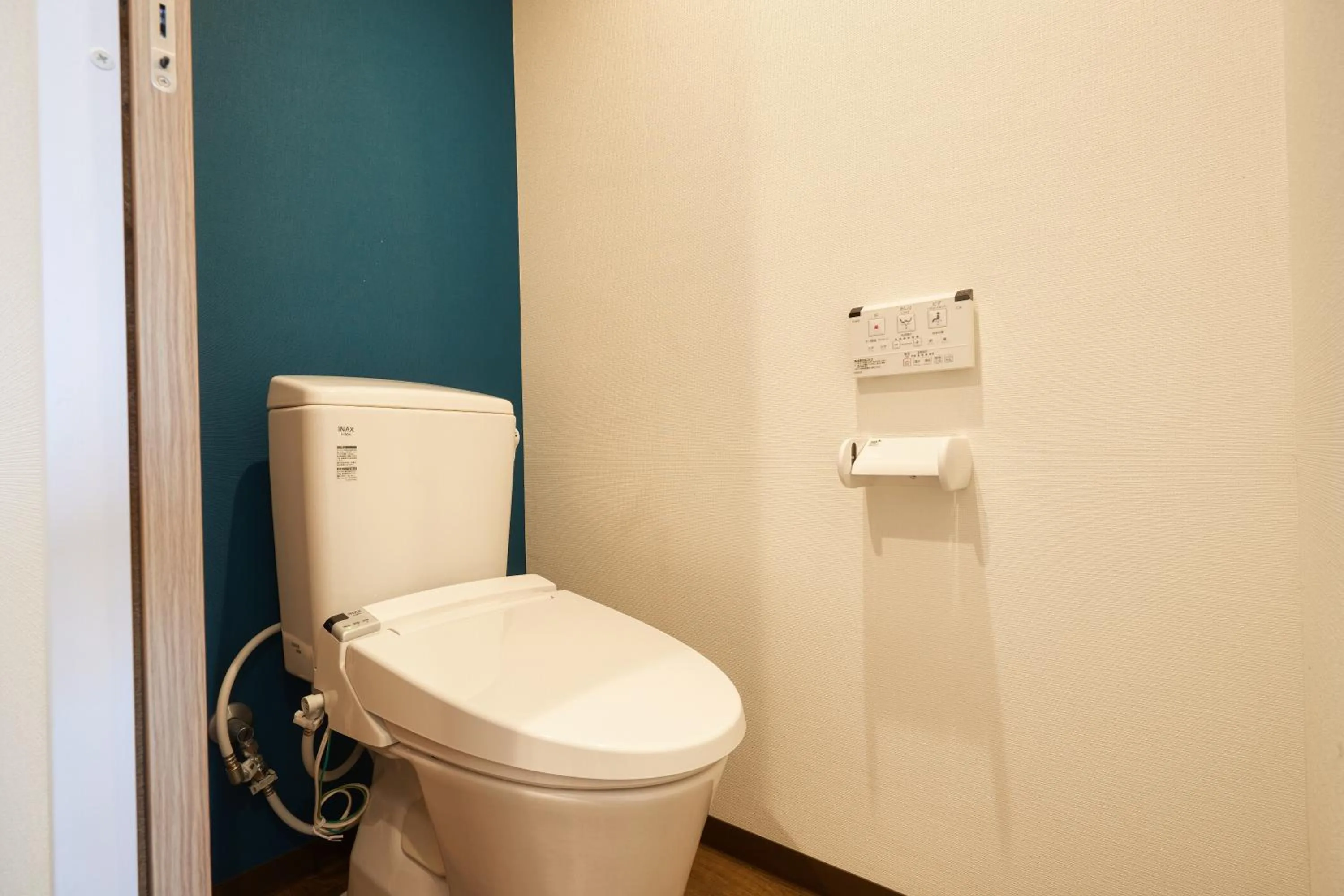 Toilet in New Normal Hotel in NAMINOUE ニューノーマルホテルイン波の上