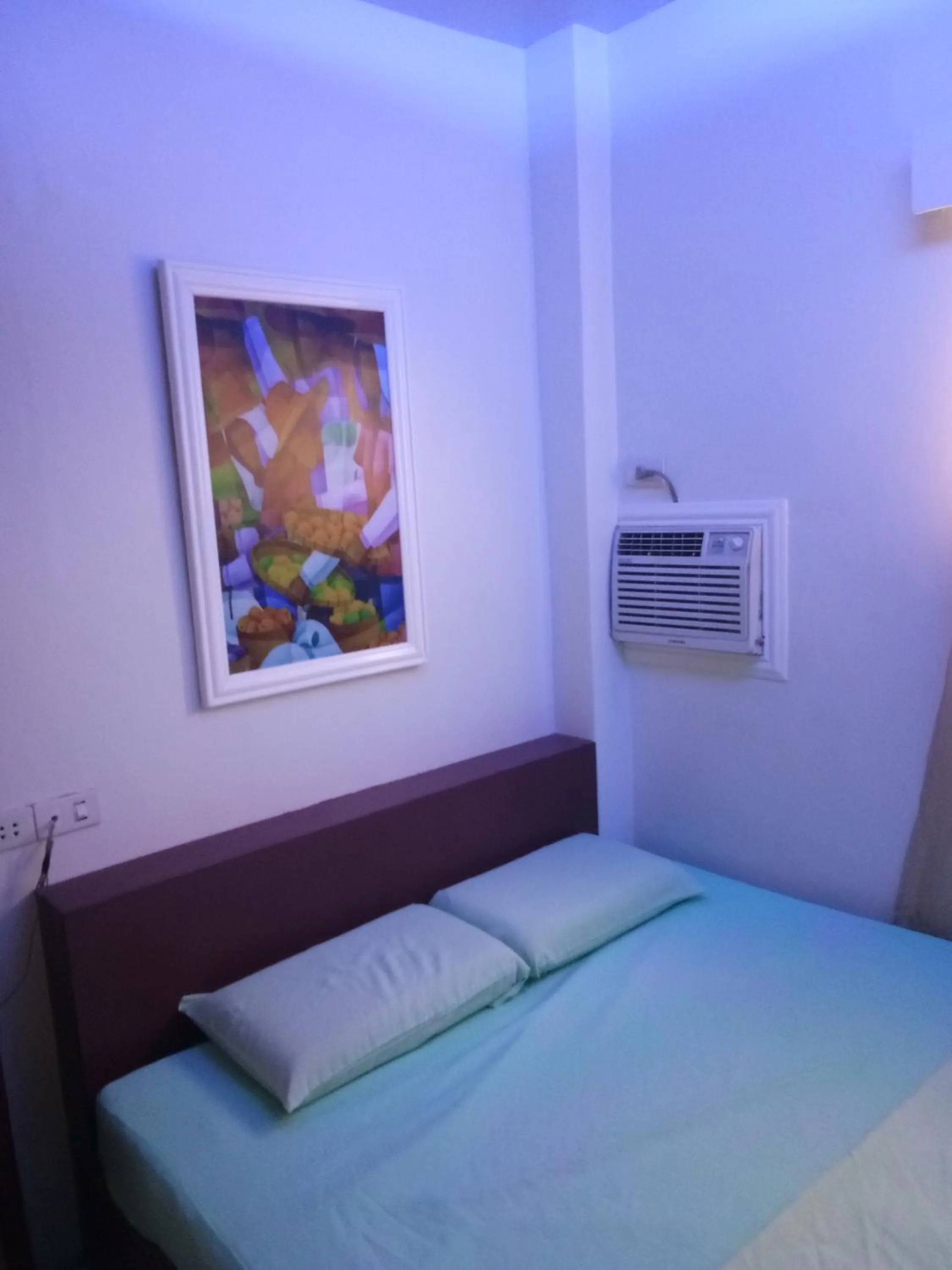 Bed in Anthurium Inn