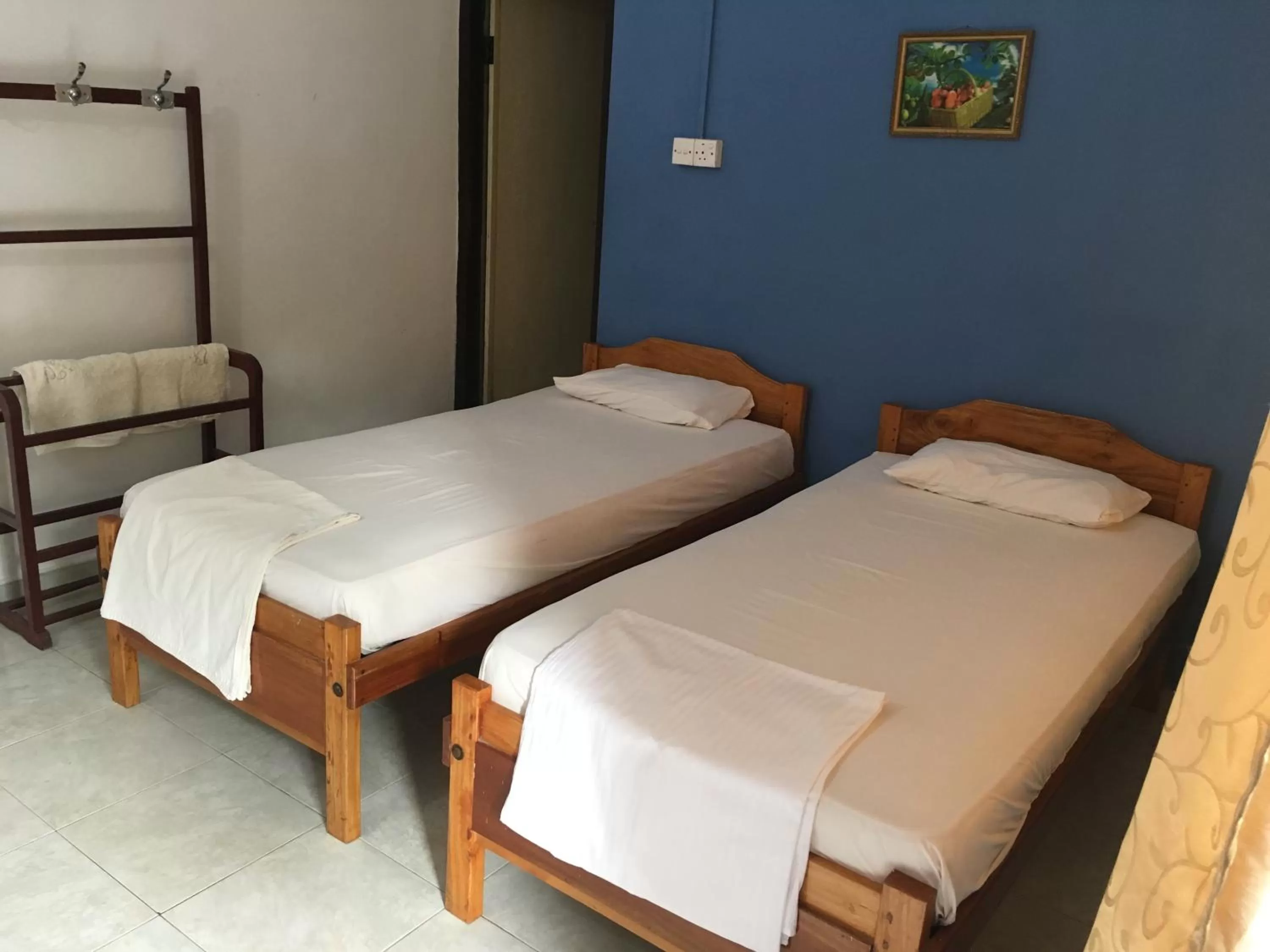 Bed in Gnaanams Hotel and Restaurant