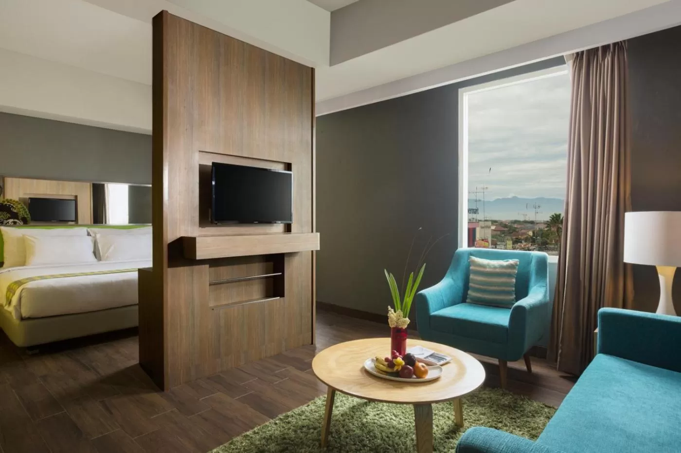 Living room, Bed in Khas Hotel Pekalongan