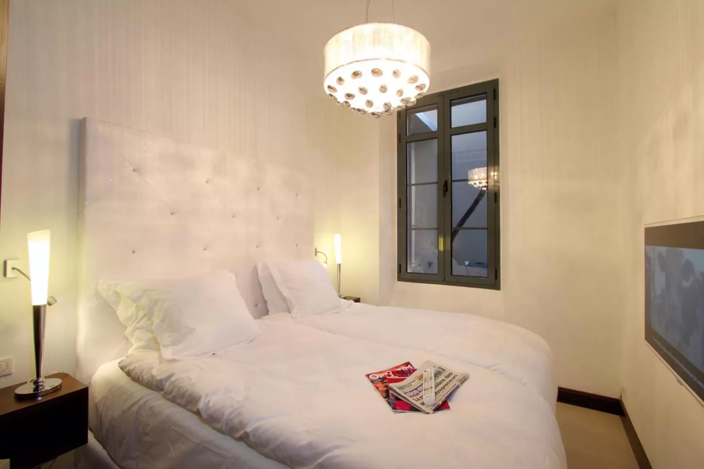 Photo of the whole room, Bed in GOLDEN TULIP CANNES HOTEL de PARIS