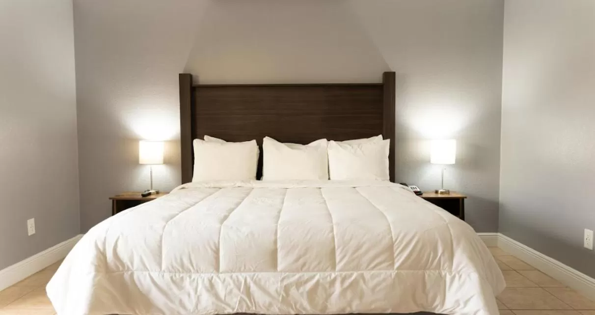 Bed in Celebration Suites 2 Bedroom Condo