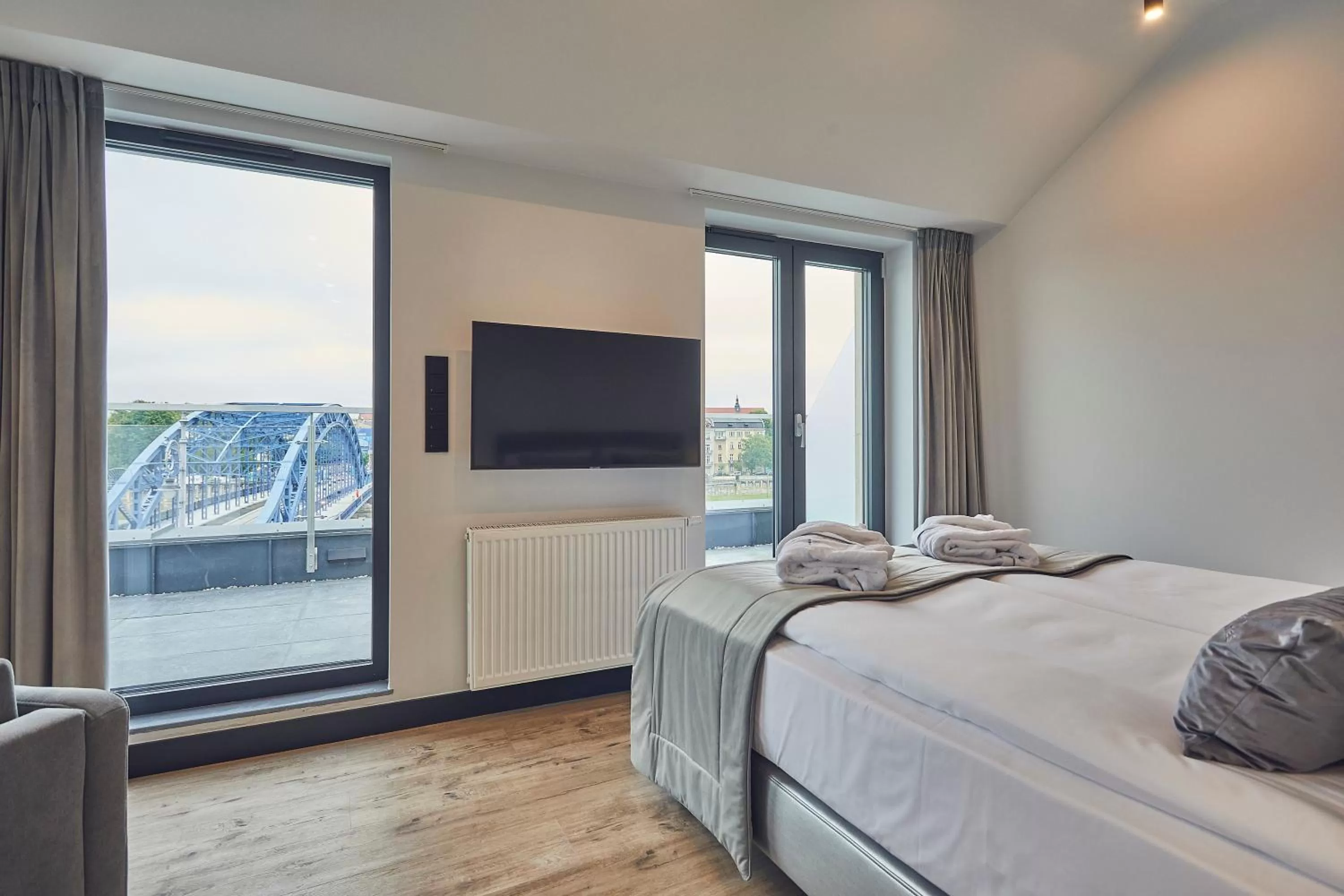 Bed in The Bridge Suites Hotel