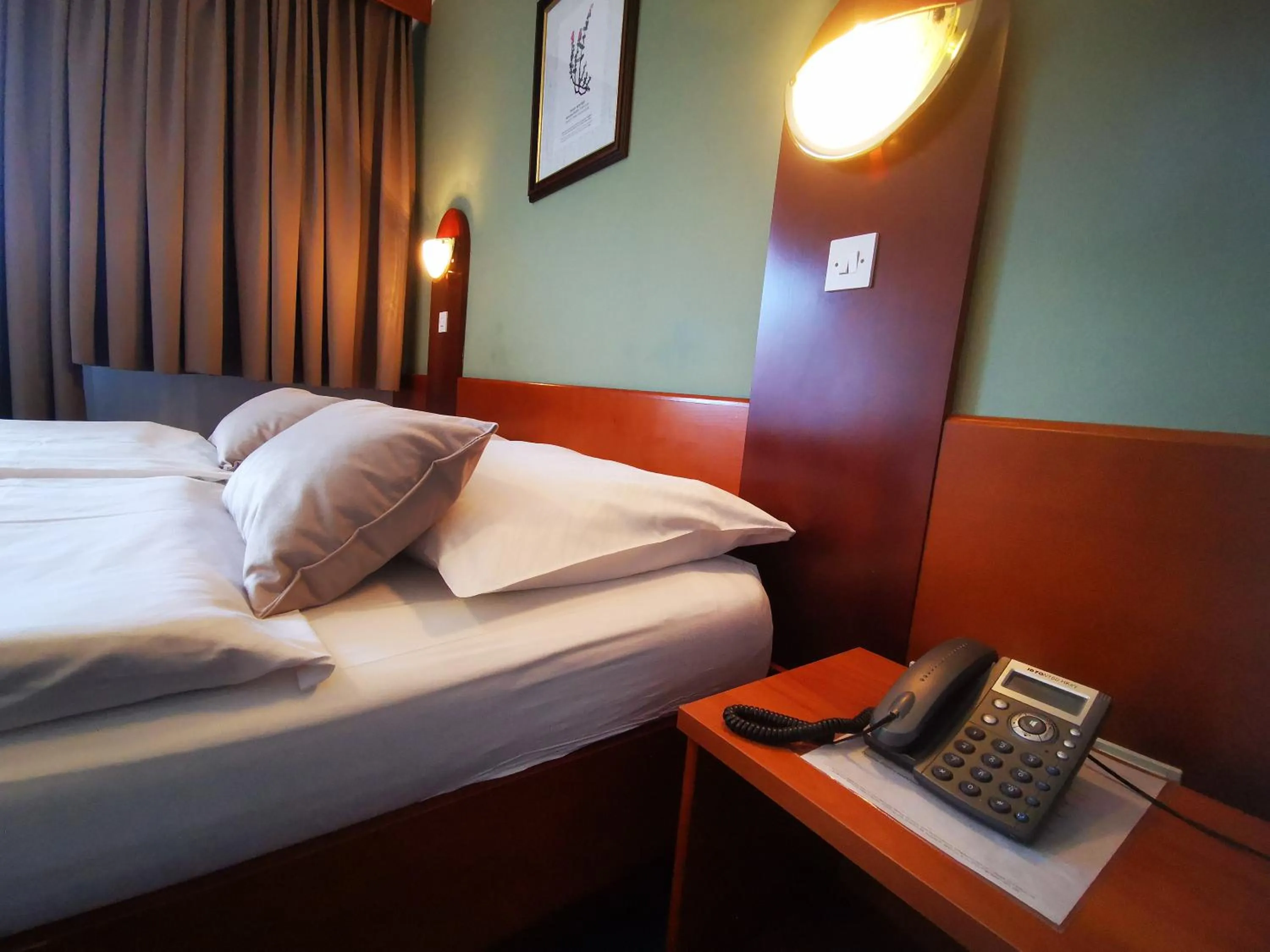 Bed in Hotel Tripič, restaurant and pizzeria