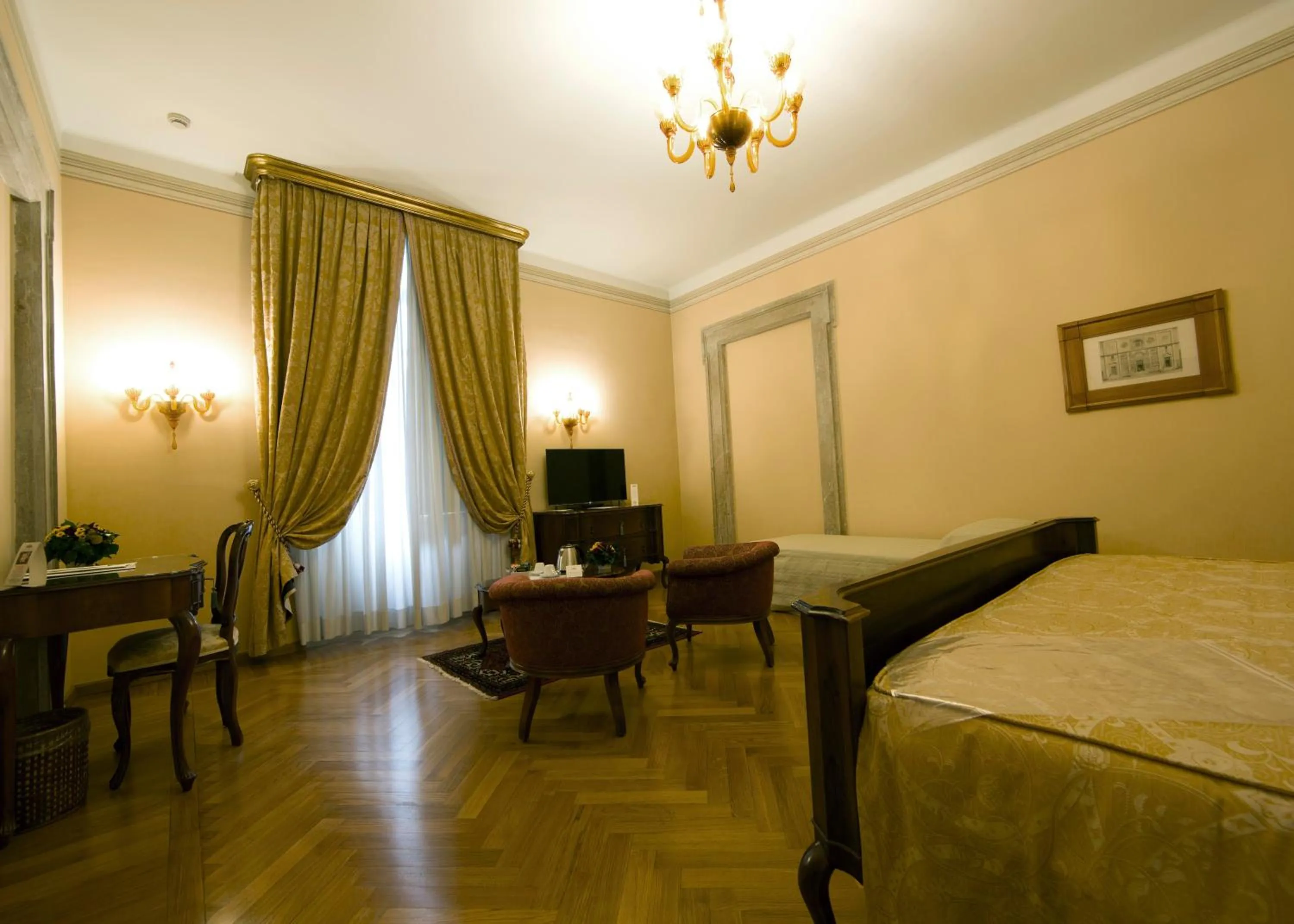 Bed in Villa Fenaroli Palace Hotel