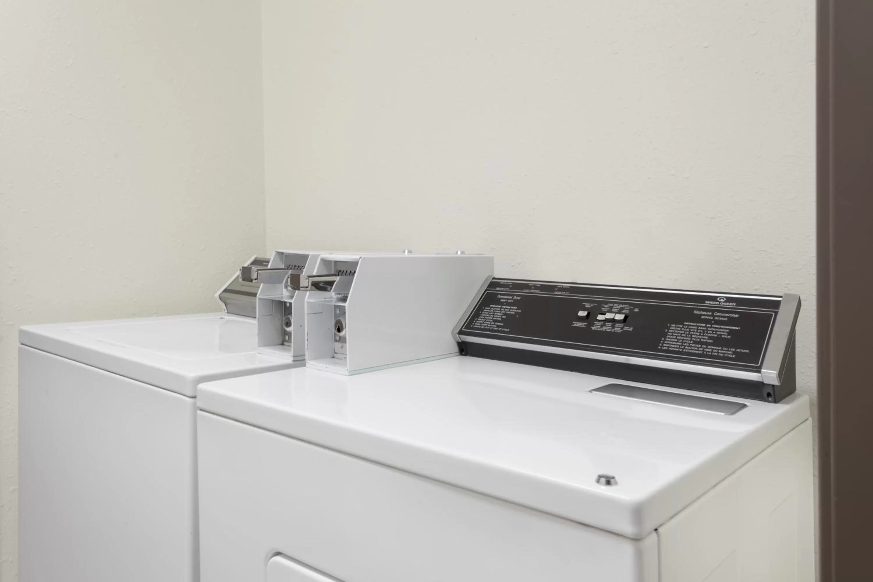 washing machine in Super 8 by Wyndham Prince Albert