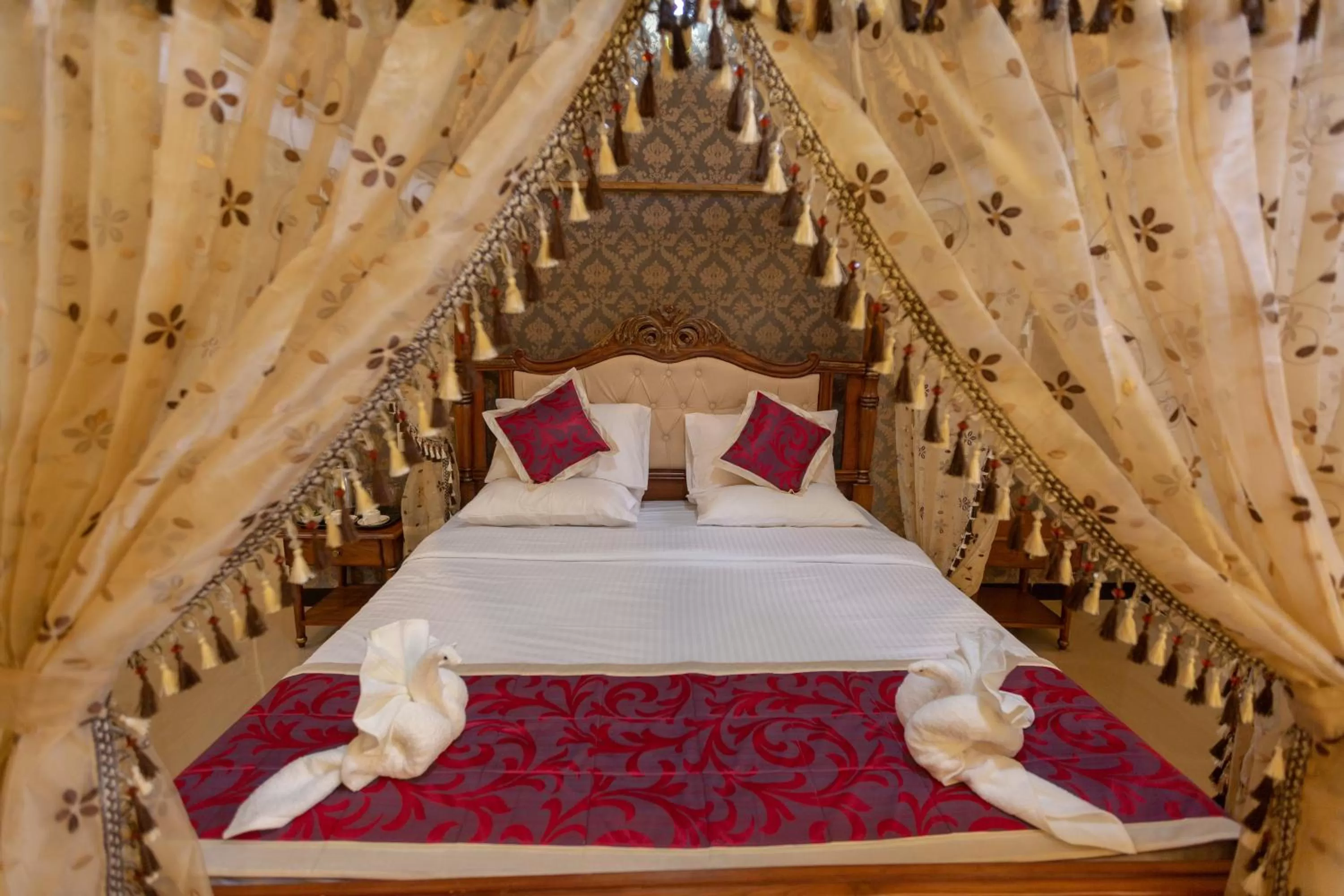 Bed in KSTDC Hotel Mayura Krishna Almatti