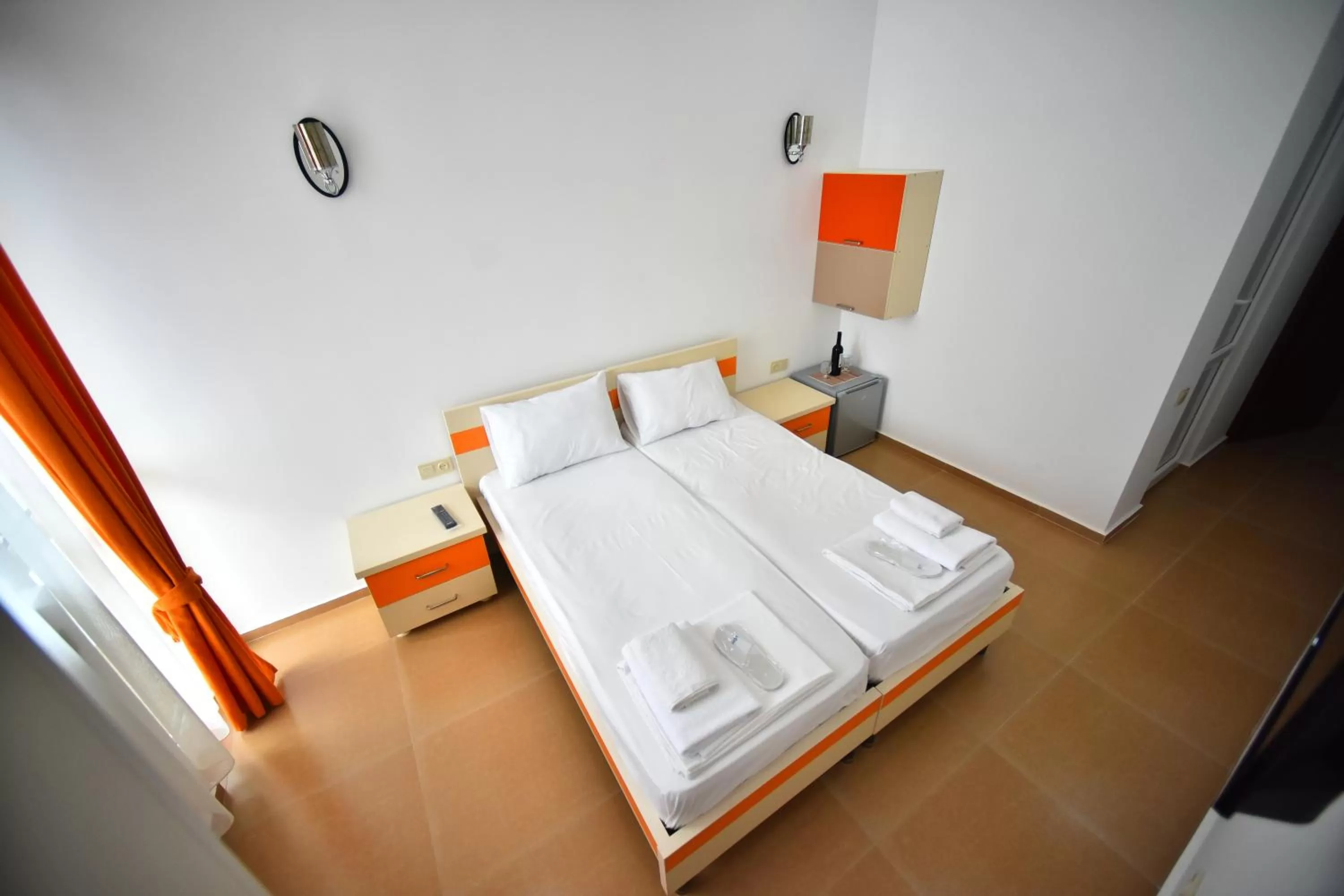 Bed in Orange Home Hotel