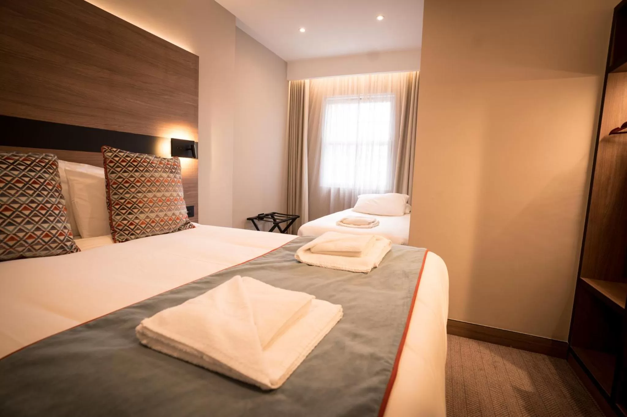 Bed in Merit Kensington Hotel