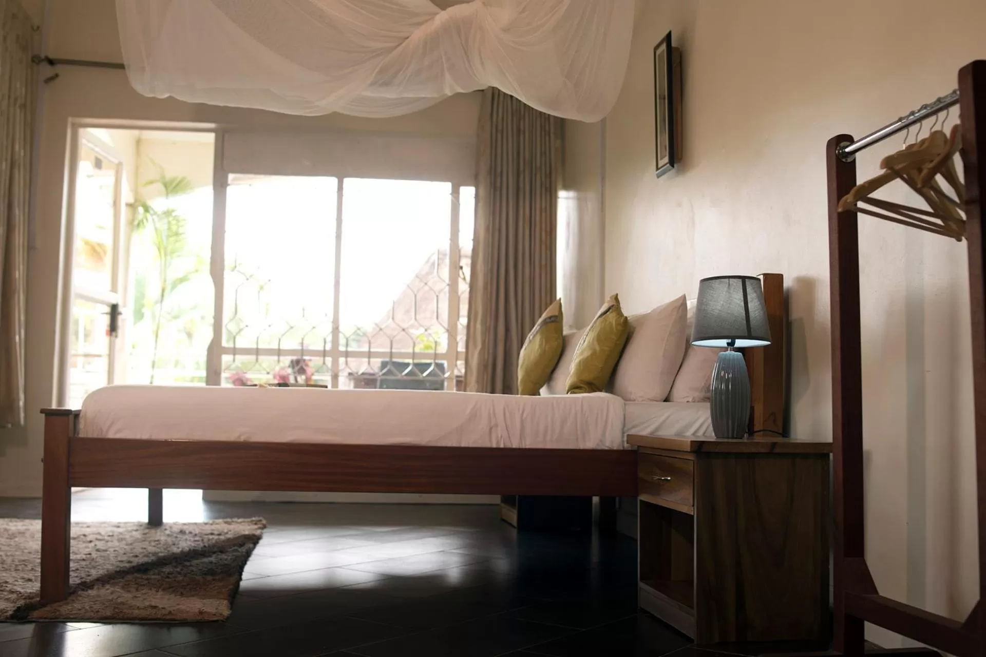 Bed, Seating Area in Entebbe Palm Hotel