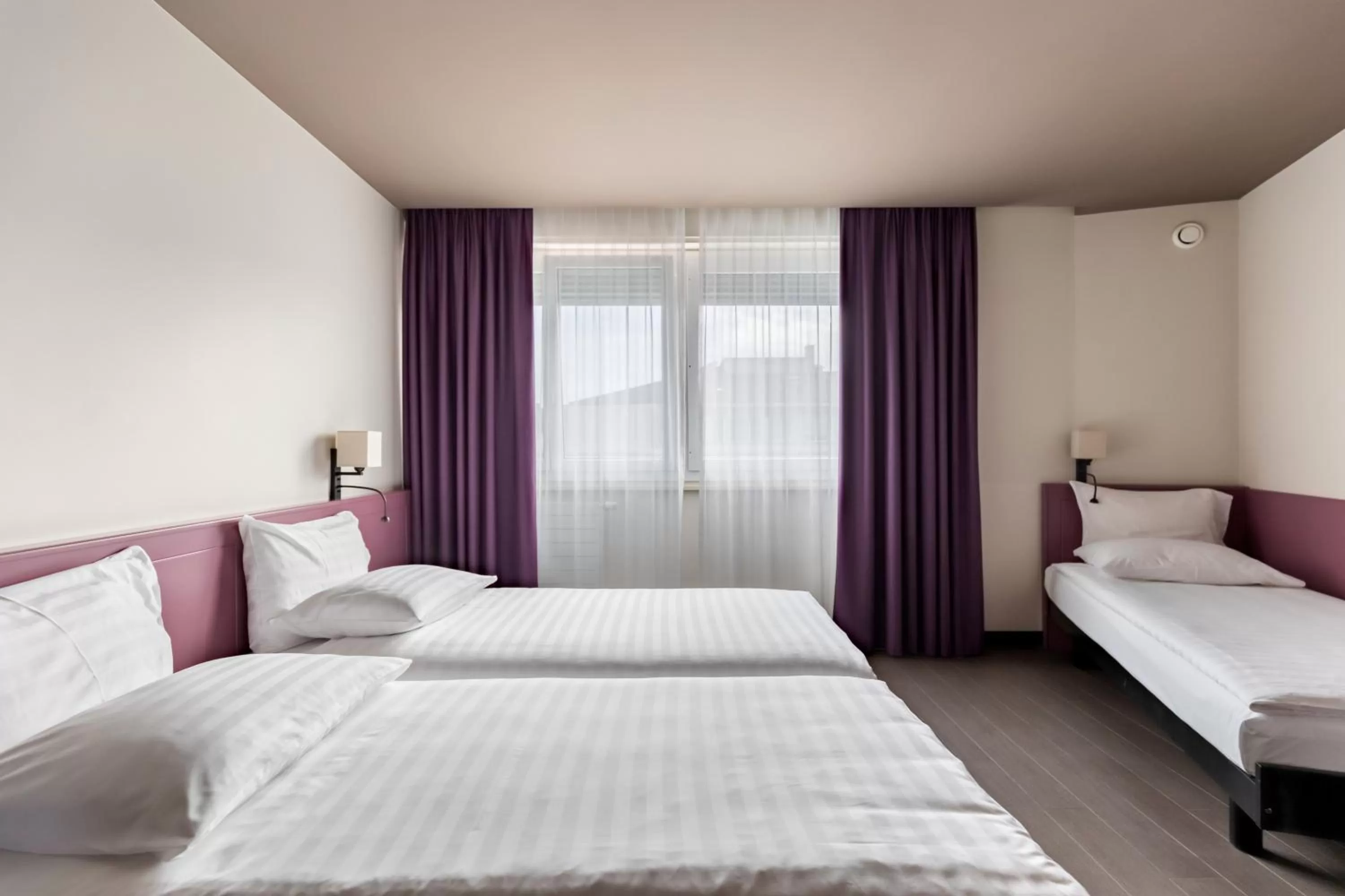 Bed in Hôtel Les Nations