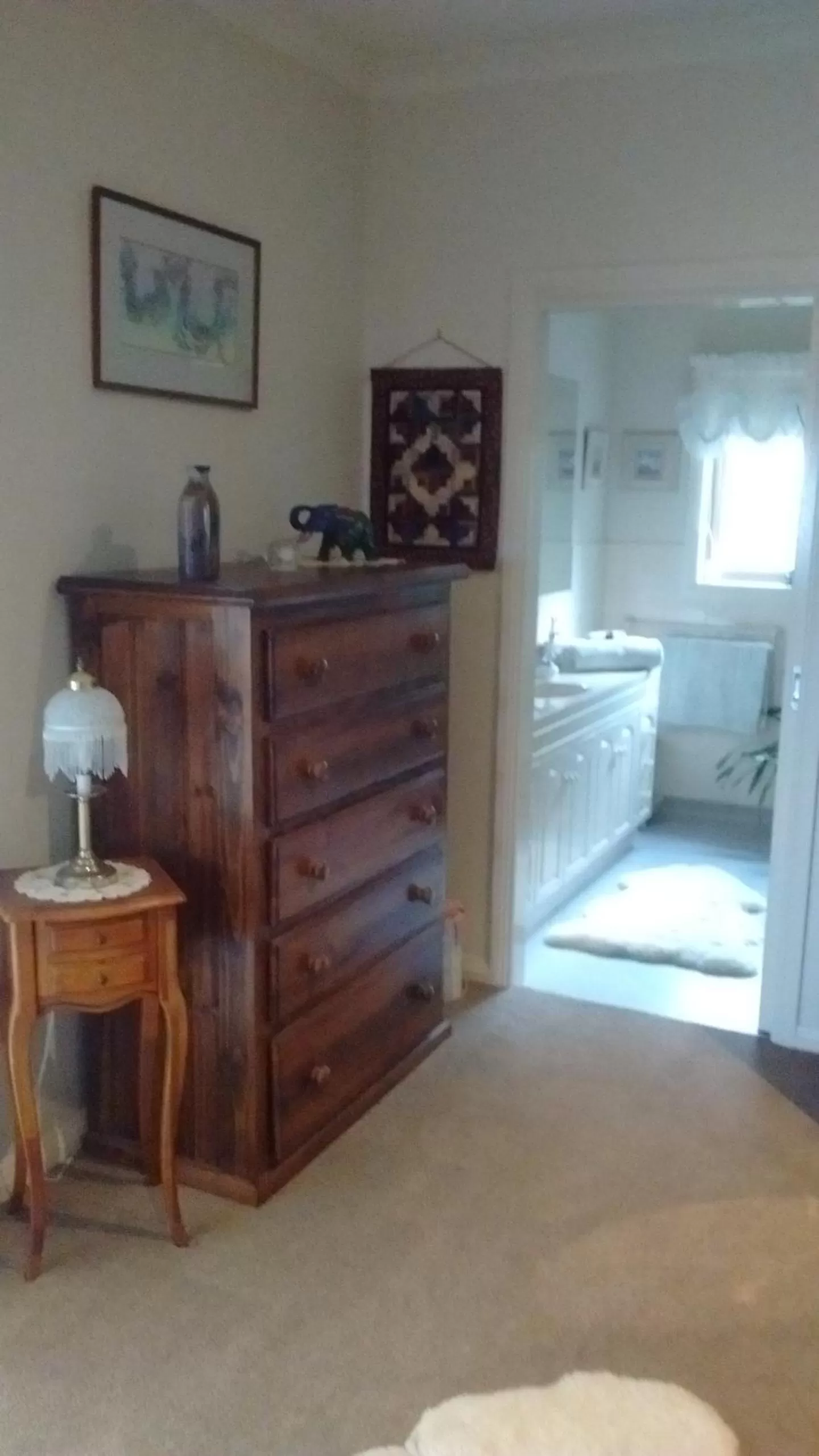 Bed in Rosewood Park Guest Suite