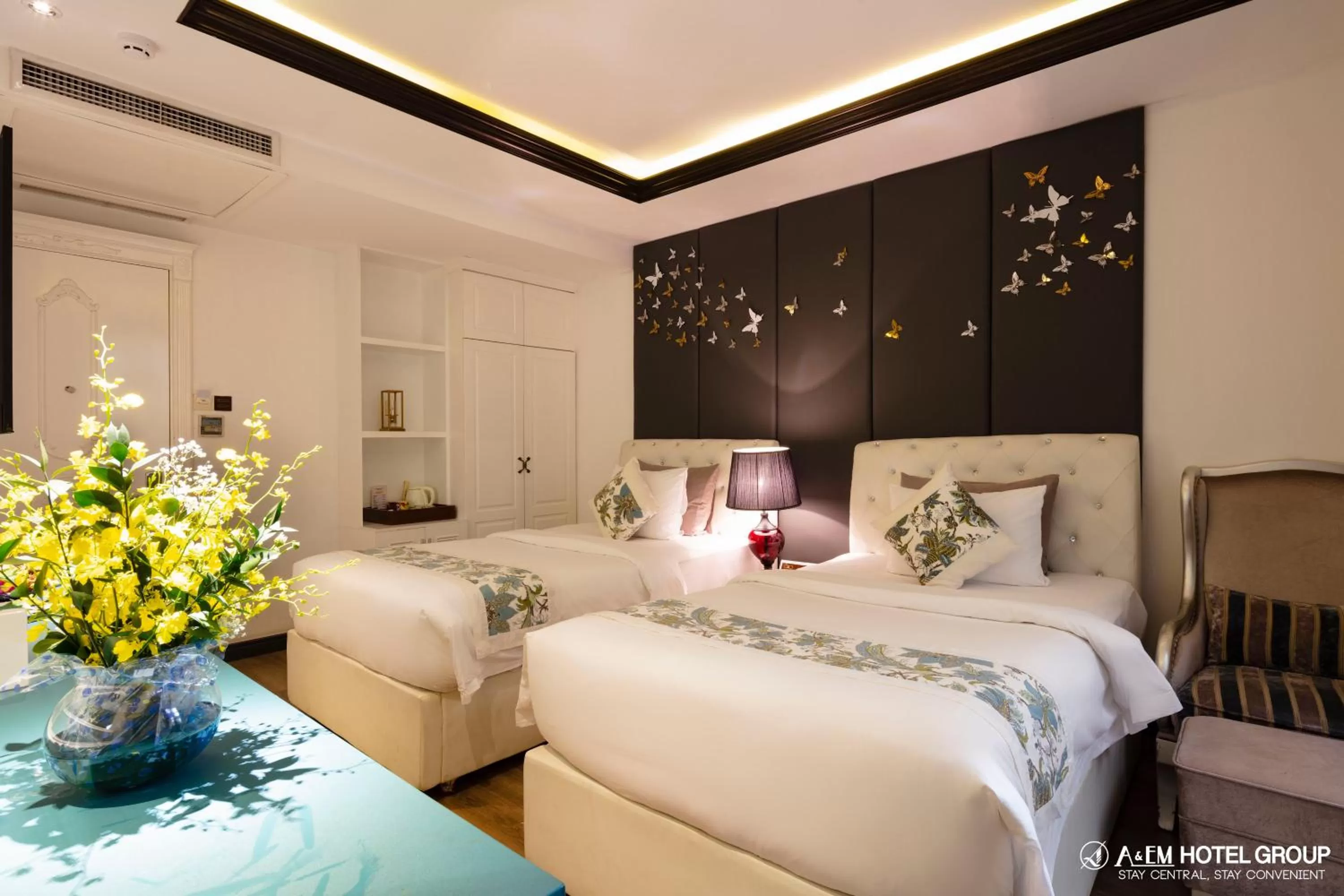 Bed in A&EM Saigon Hotel