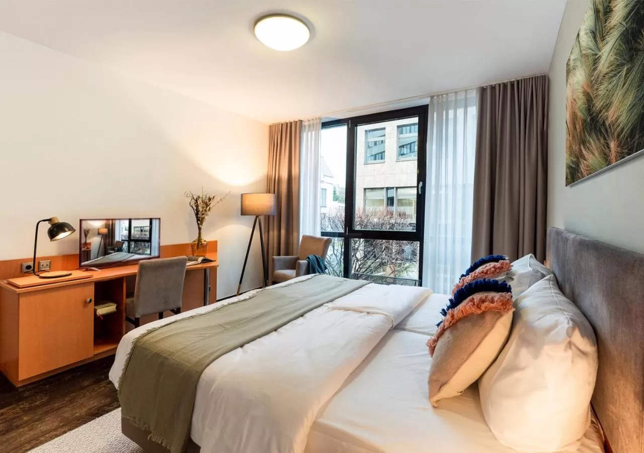 Bed in KONCEPT HOTEL Benedikt