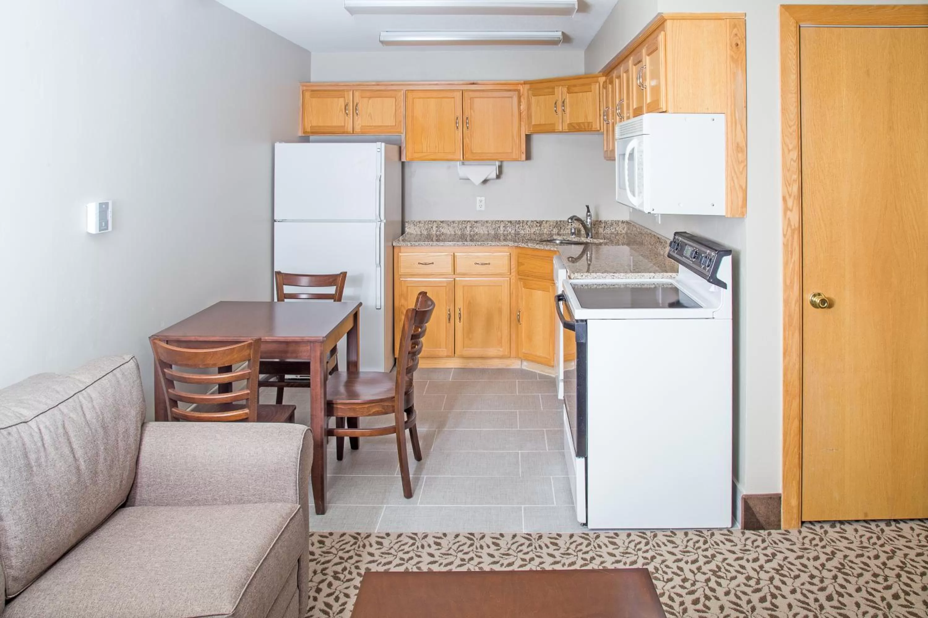Kitchen or kitchenette in Gray Wolf Inn & Suites