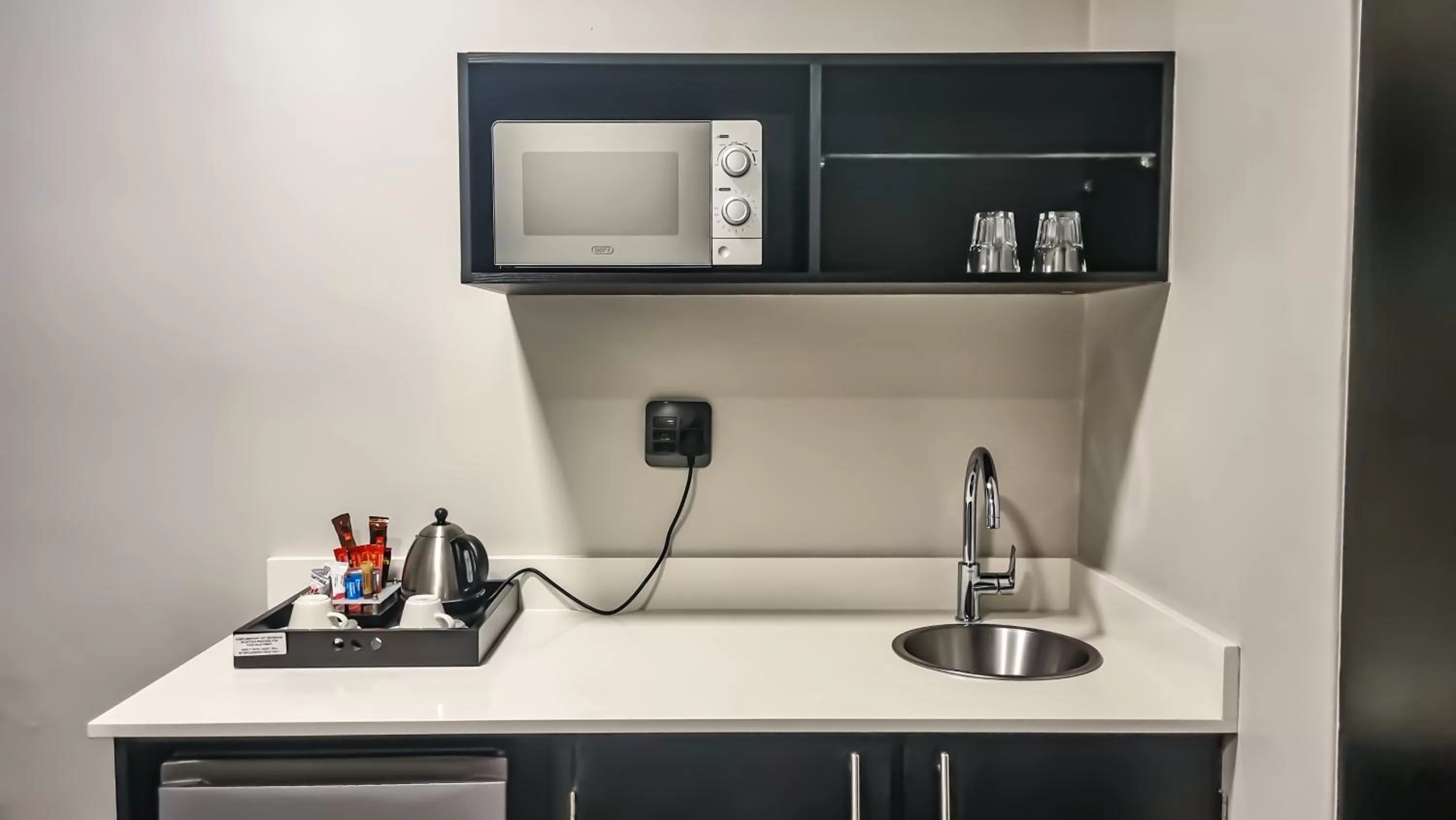 Kitchen or kitchenette in Belaire Suites Hotel