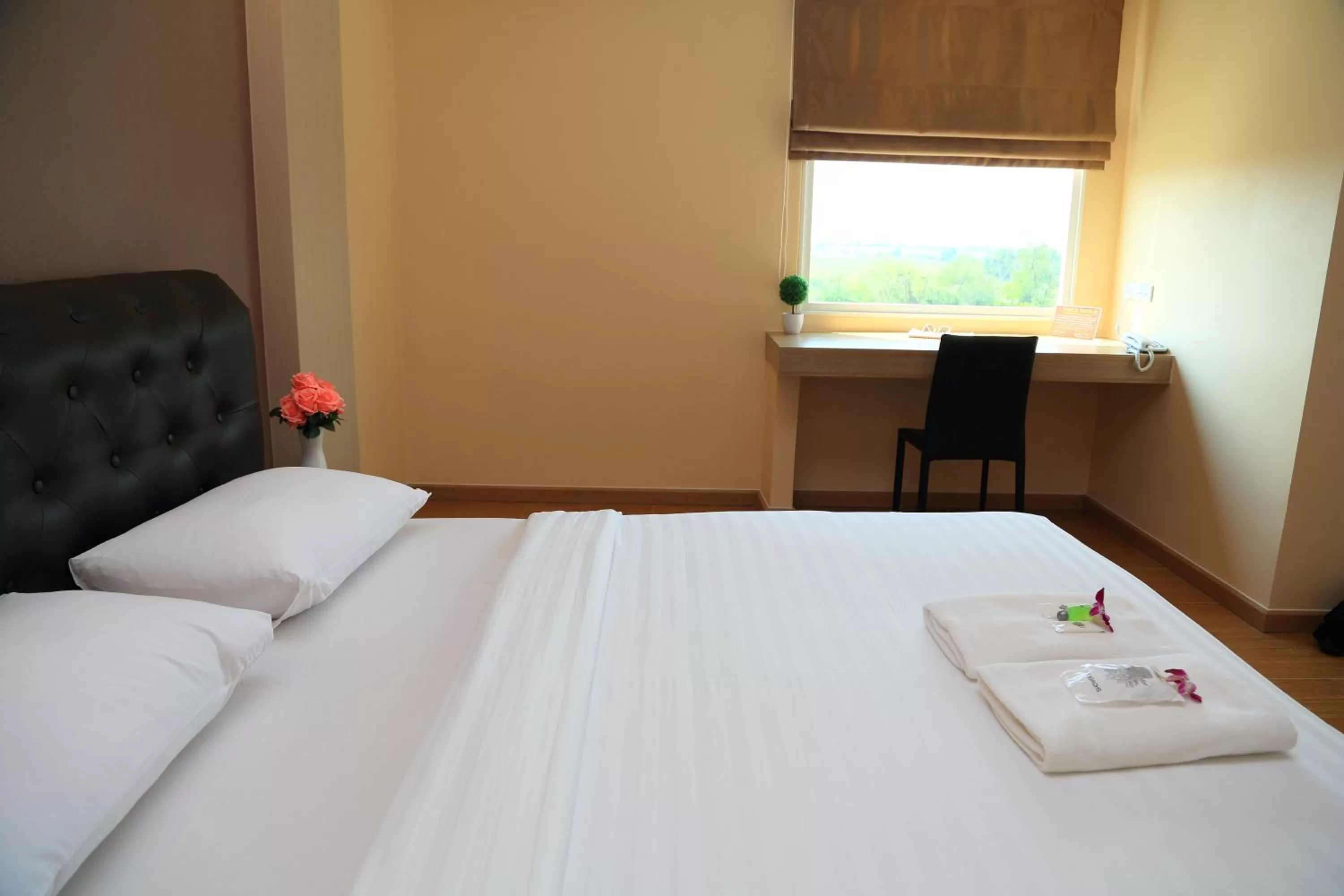 Toilet, Bed in Triple Trees Hotel