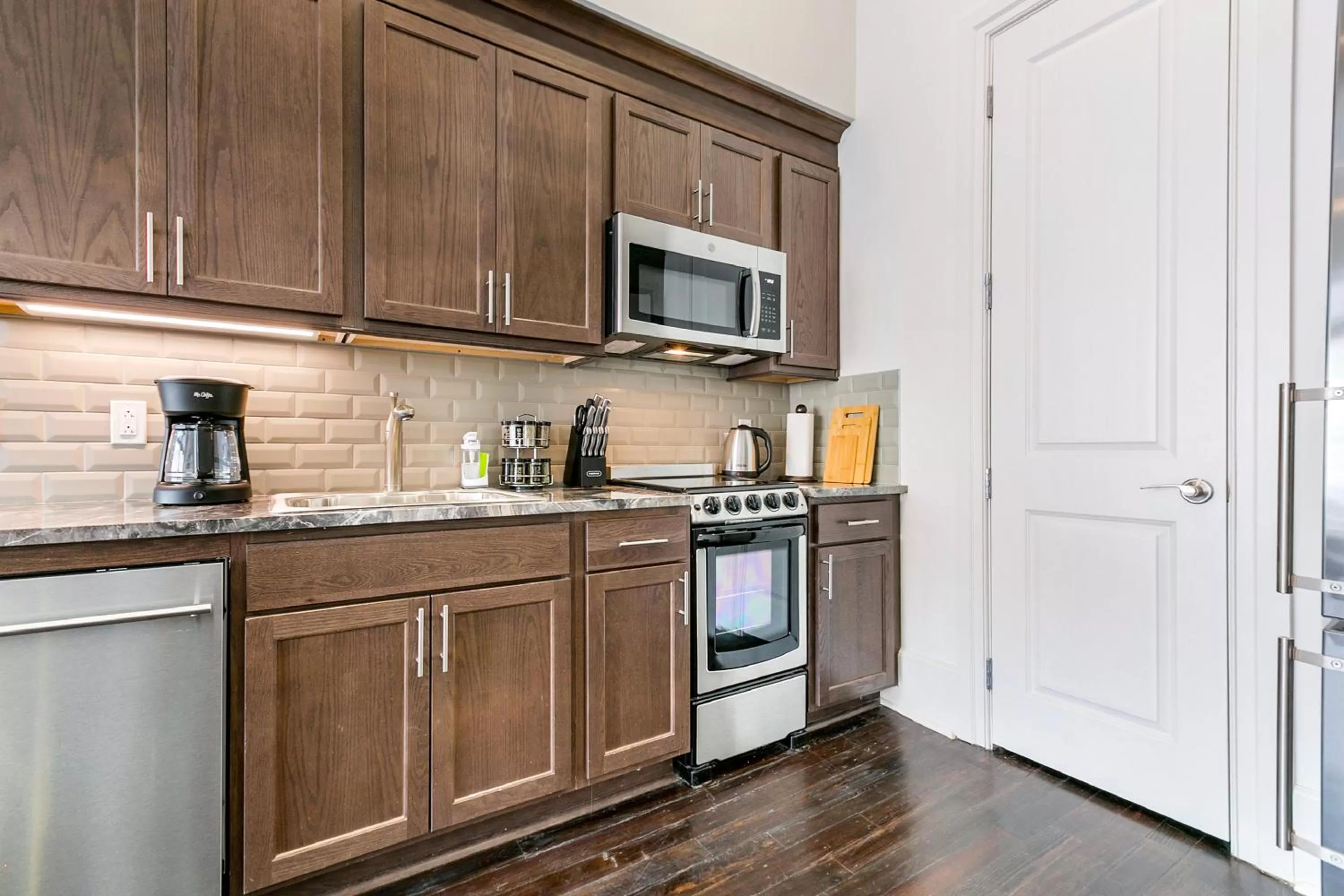 Kitchen or kitchenette in 1 and 2 BR Private Condos Steps Away From French Quarter