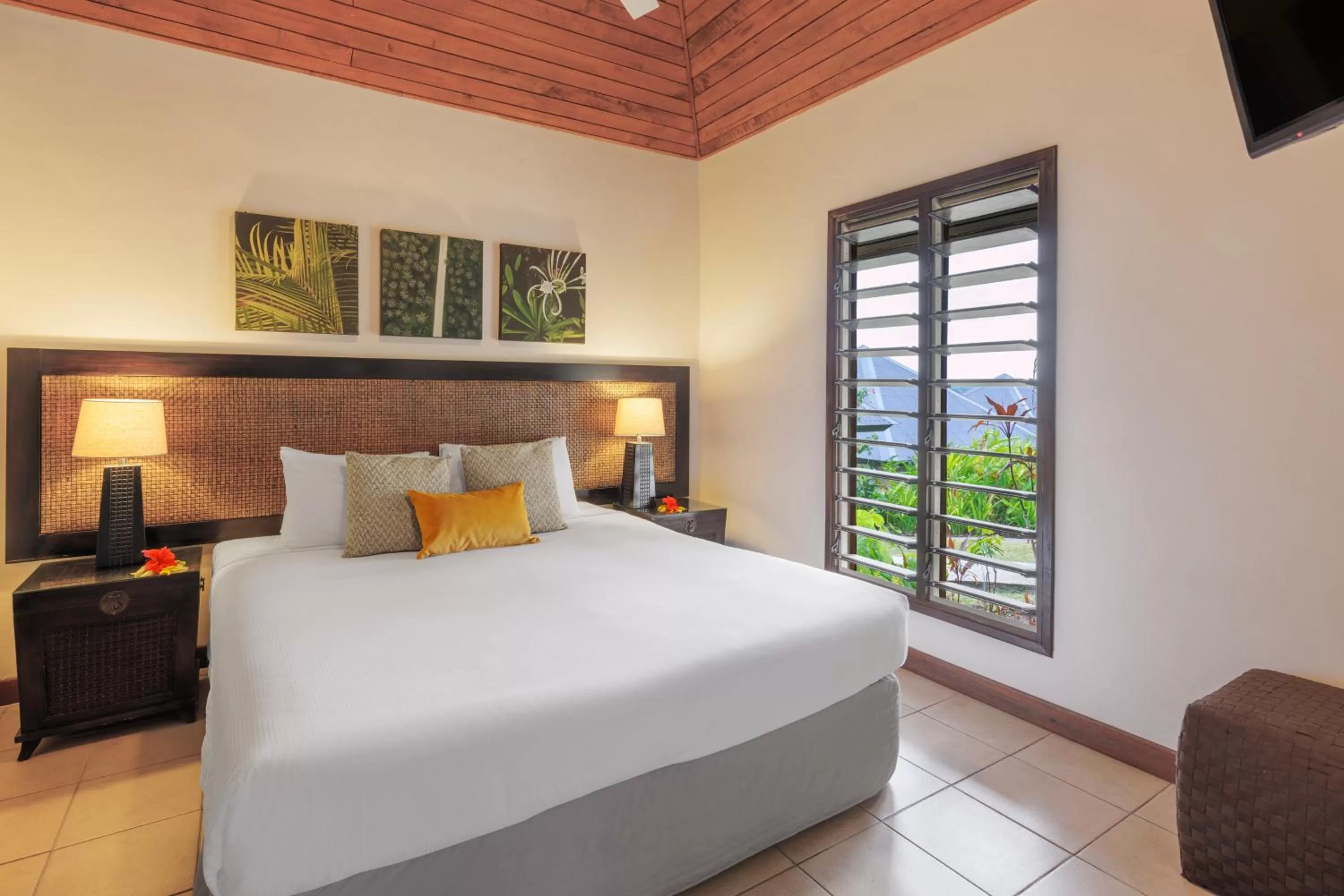 Bed in Mangoes Resort