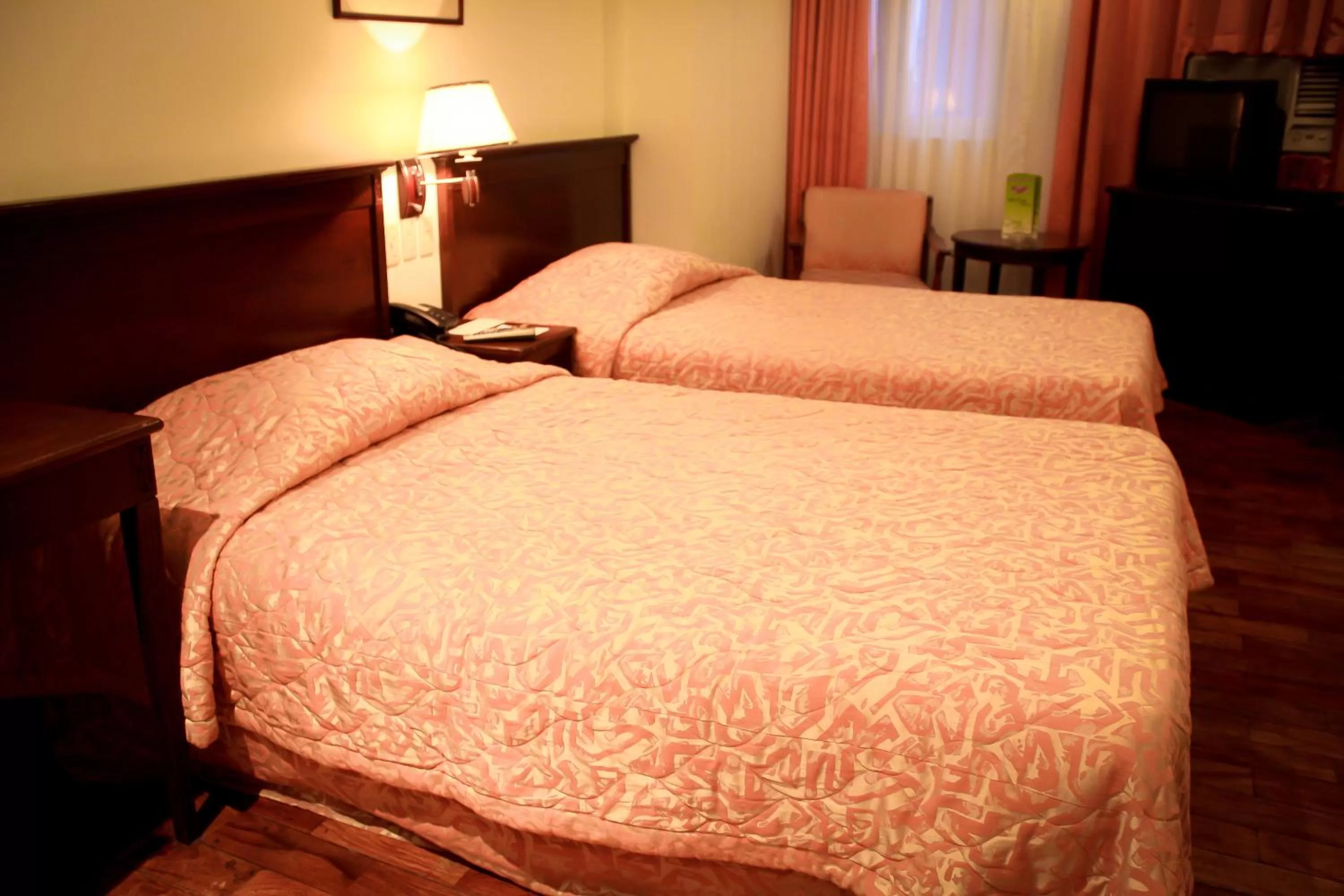 Bed in CityState Tower Hotel