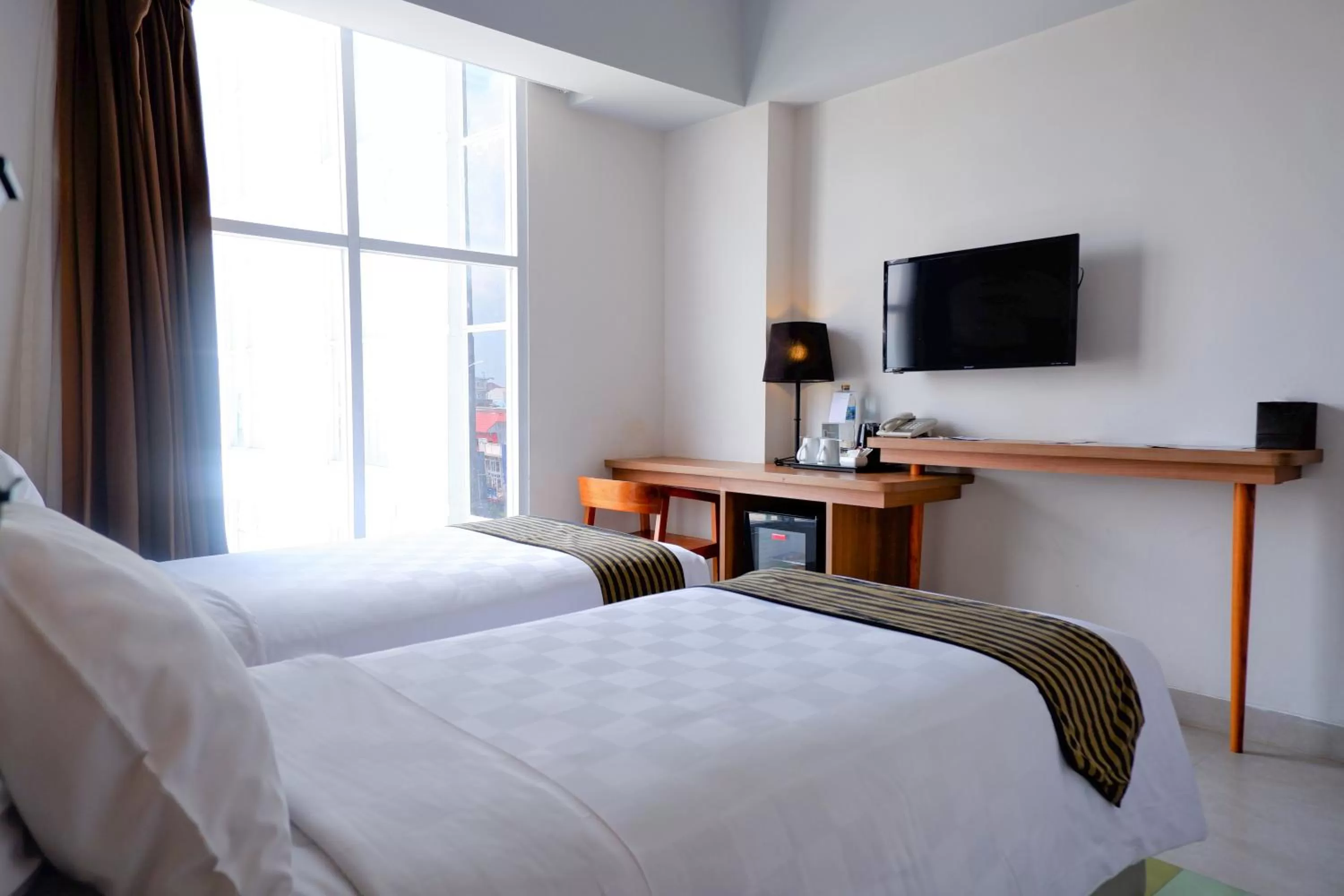 Bed in KHAS Tugu Hotel Yogyakarta