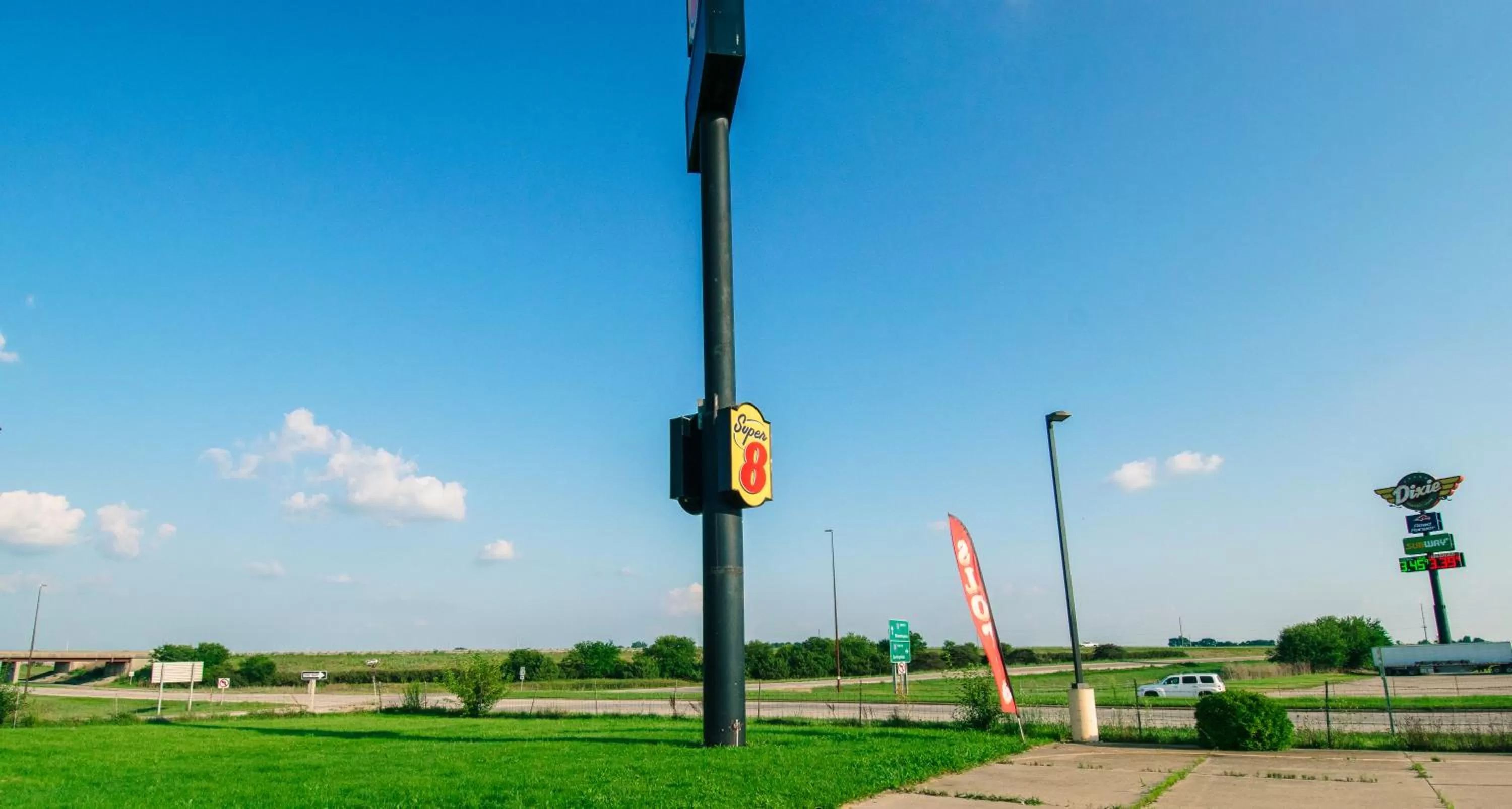 Property logo or sign in Super 8 by Wyndham McLean/Bloomington SW