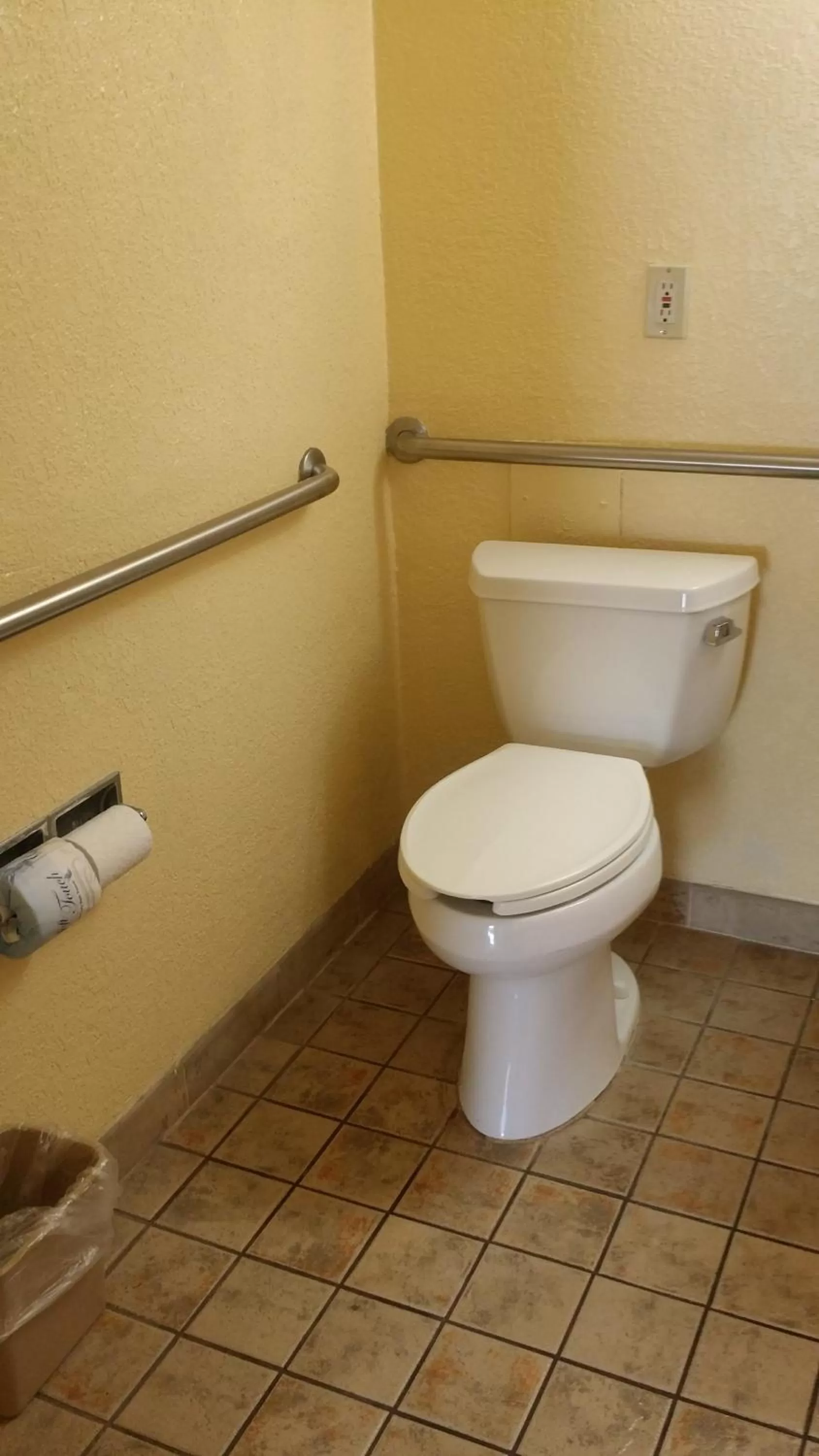 Toilet in Days Inn by Wyndham Cocoa Cruiseport West At I-95/524