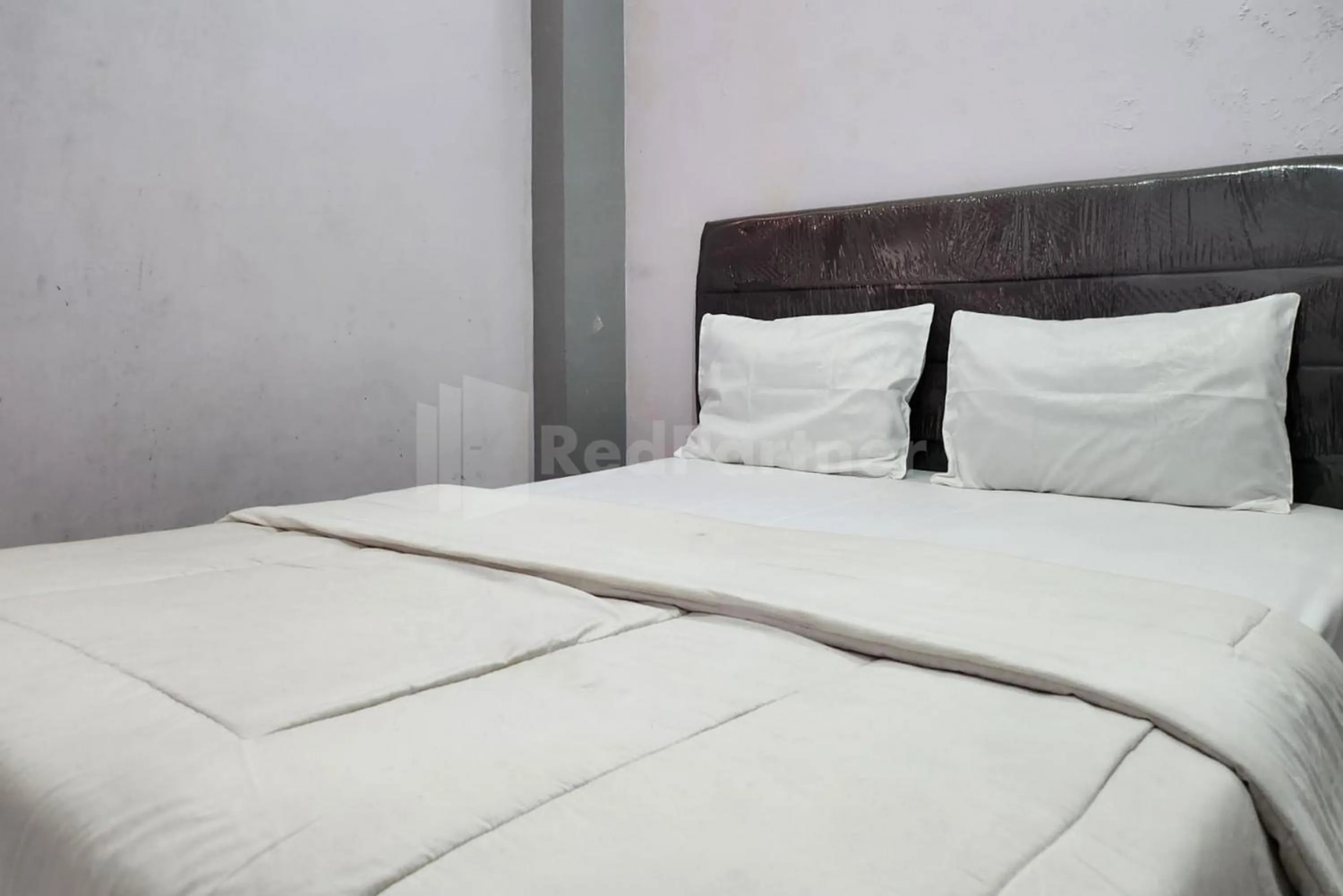 Bed in OYO 1319 Puspita Guesthouse