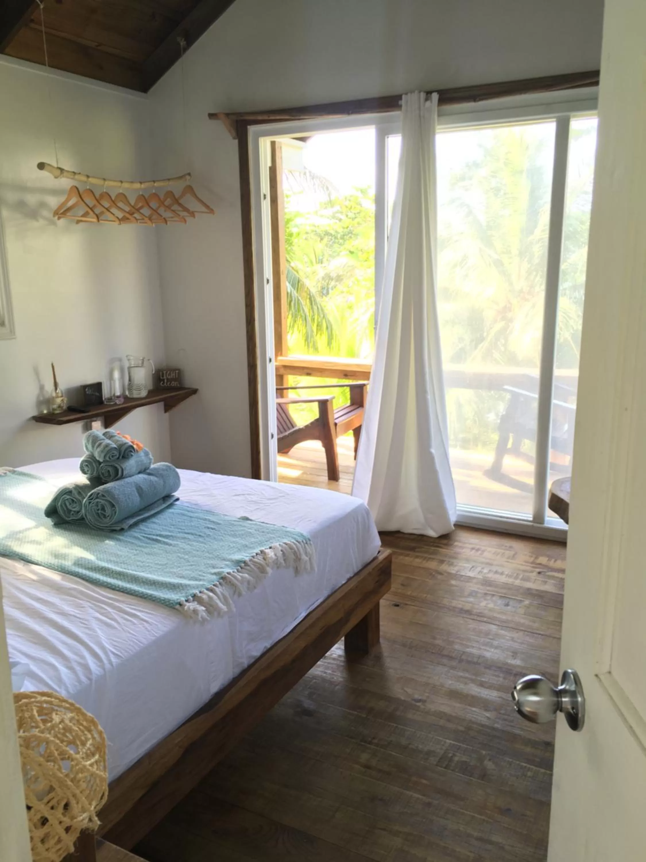 Photo of the whole room, Bed in Bird Island Bungalows