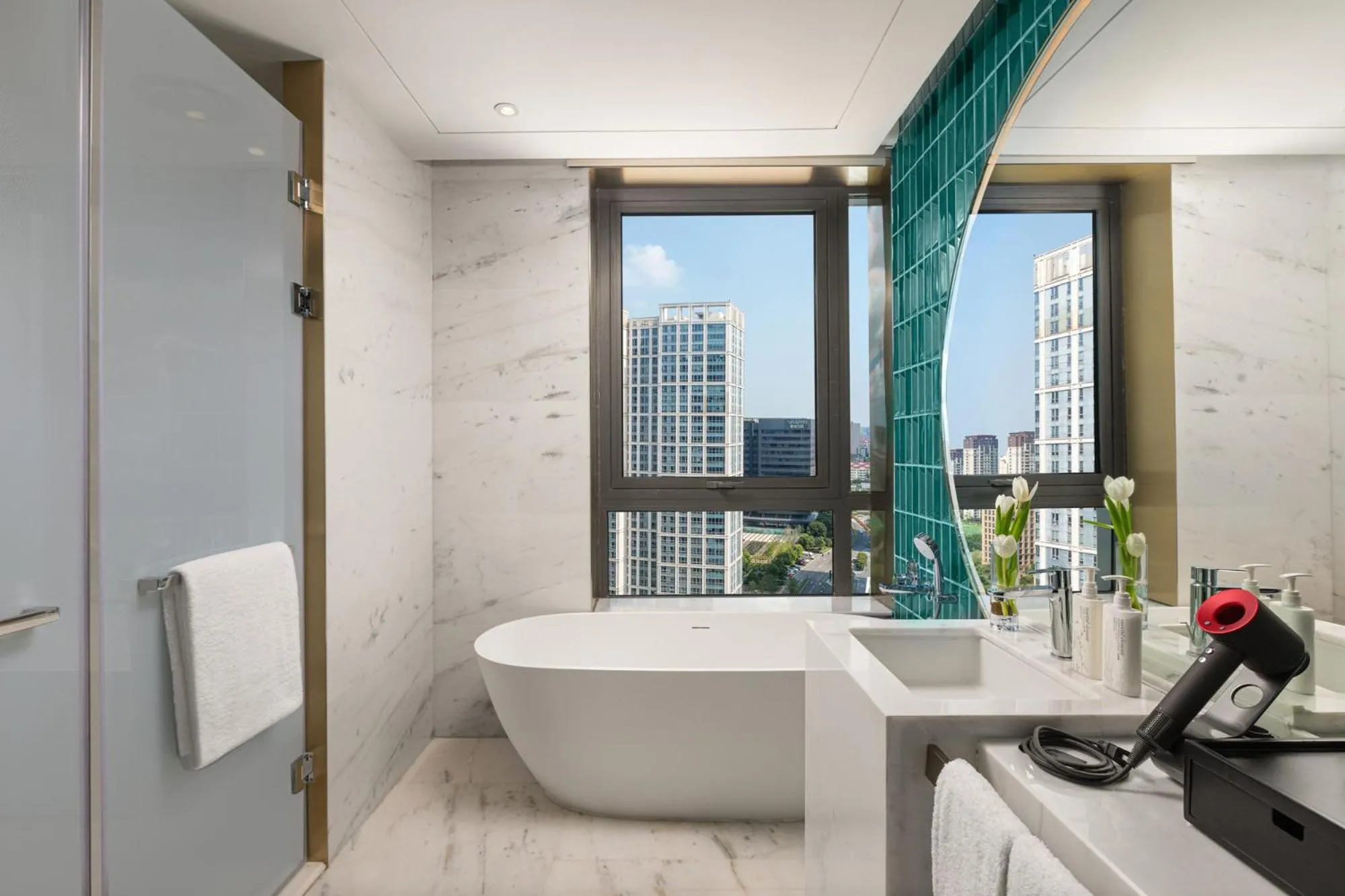 Bathroom in HUALUXE Shanghai Changfeng Park by IHG