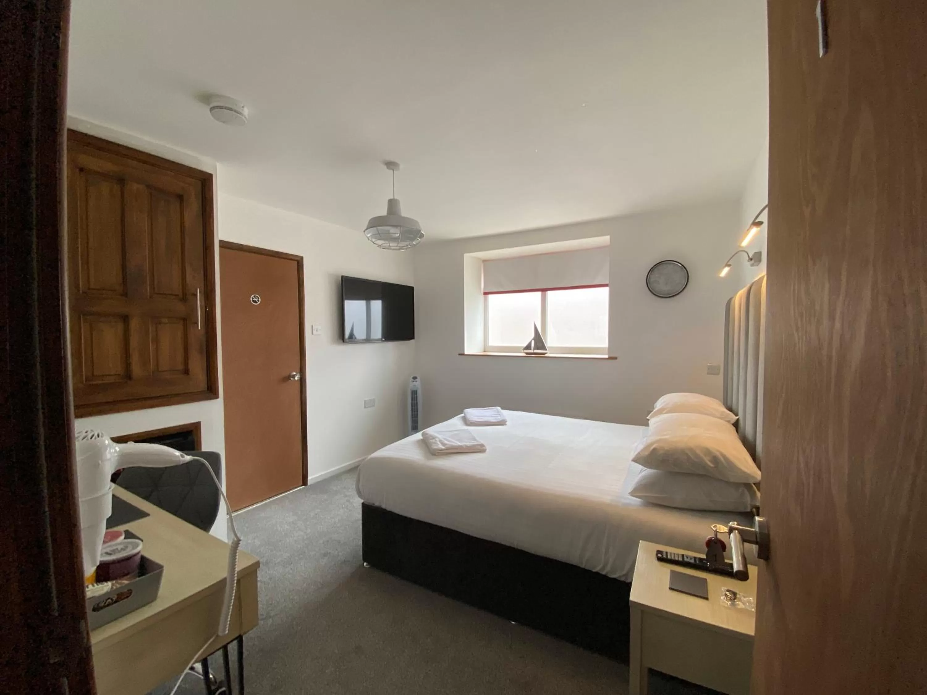 Bed in The Crossroads Inn