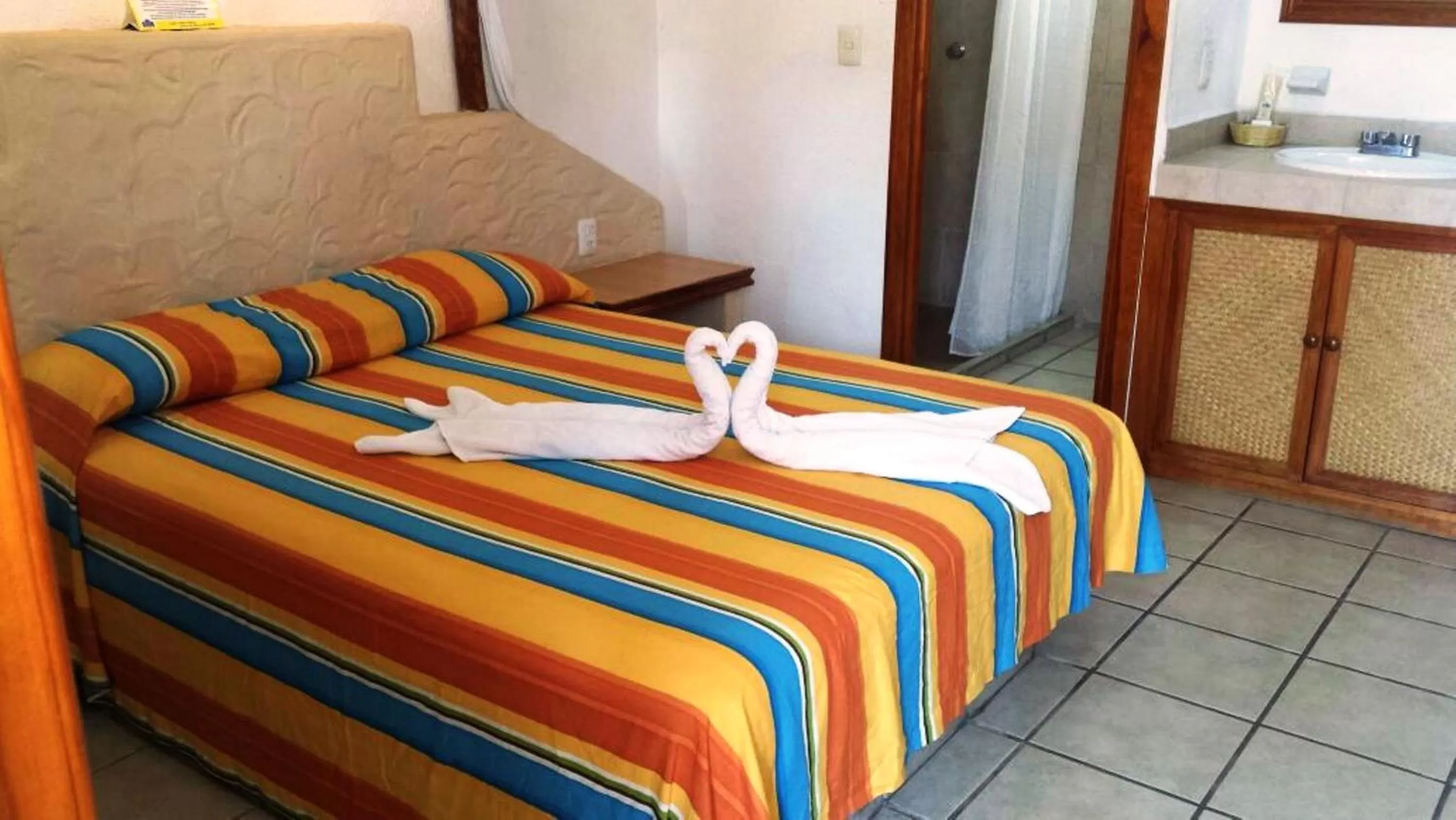 Bed in Hotel Palapa Palace