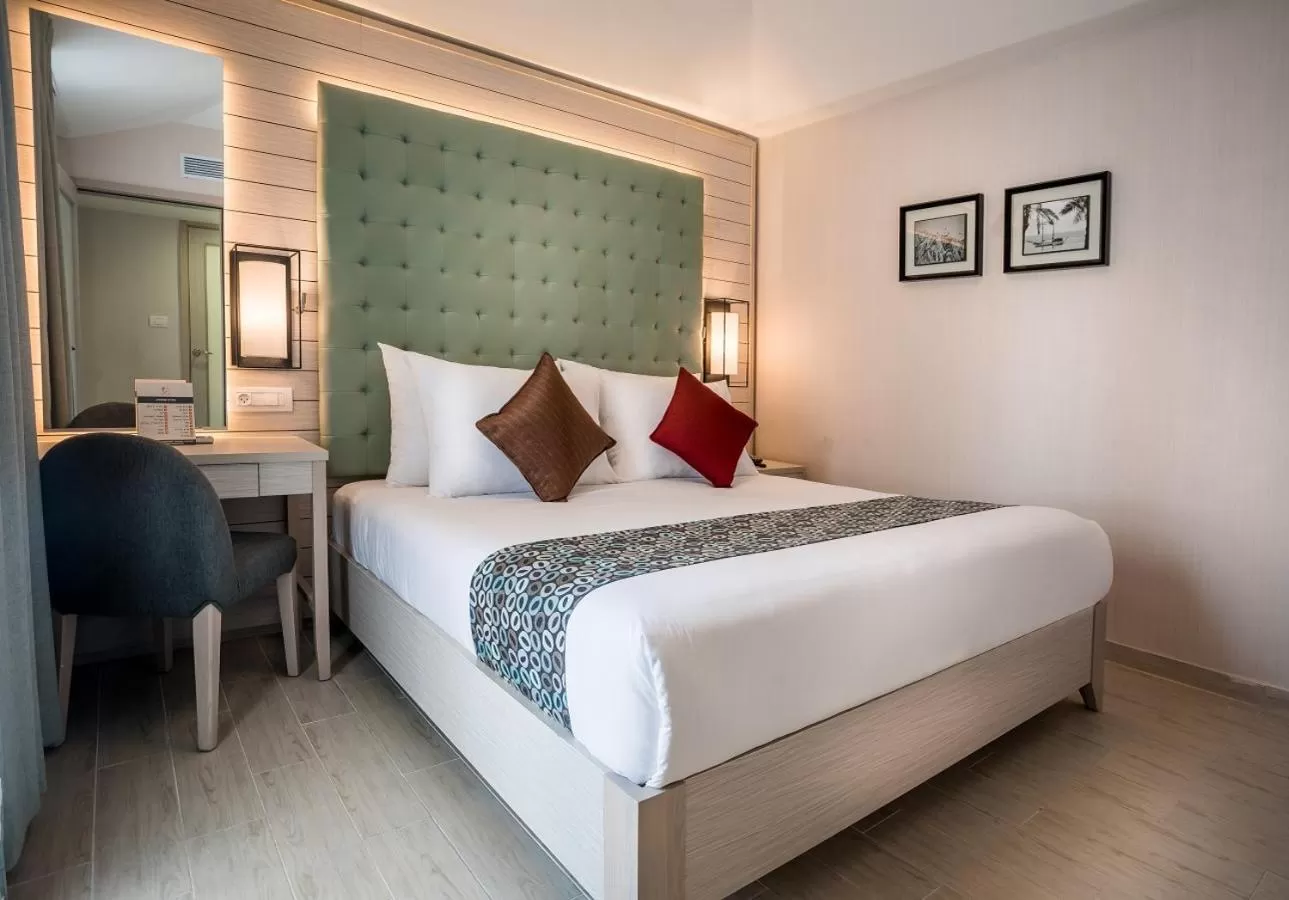 Bed in Astral Village Hotel