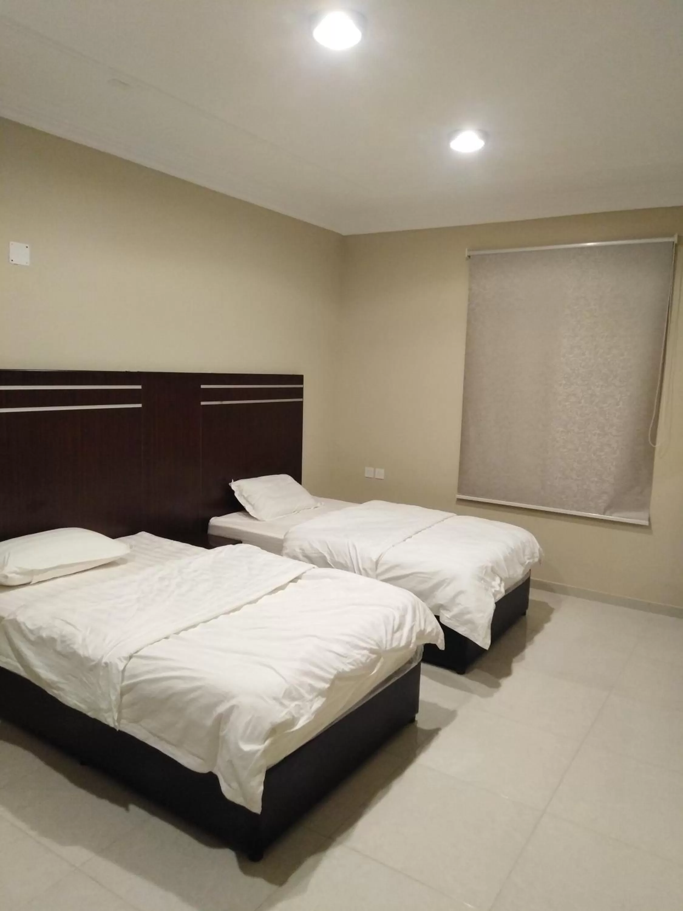 Bed in Sunrise Furnished Apartment