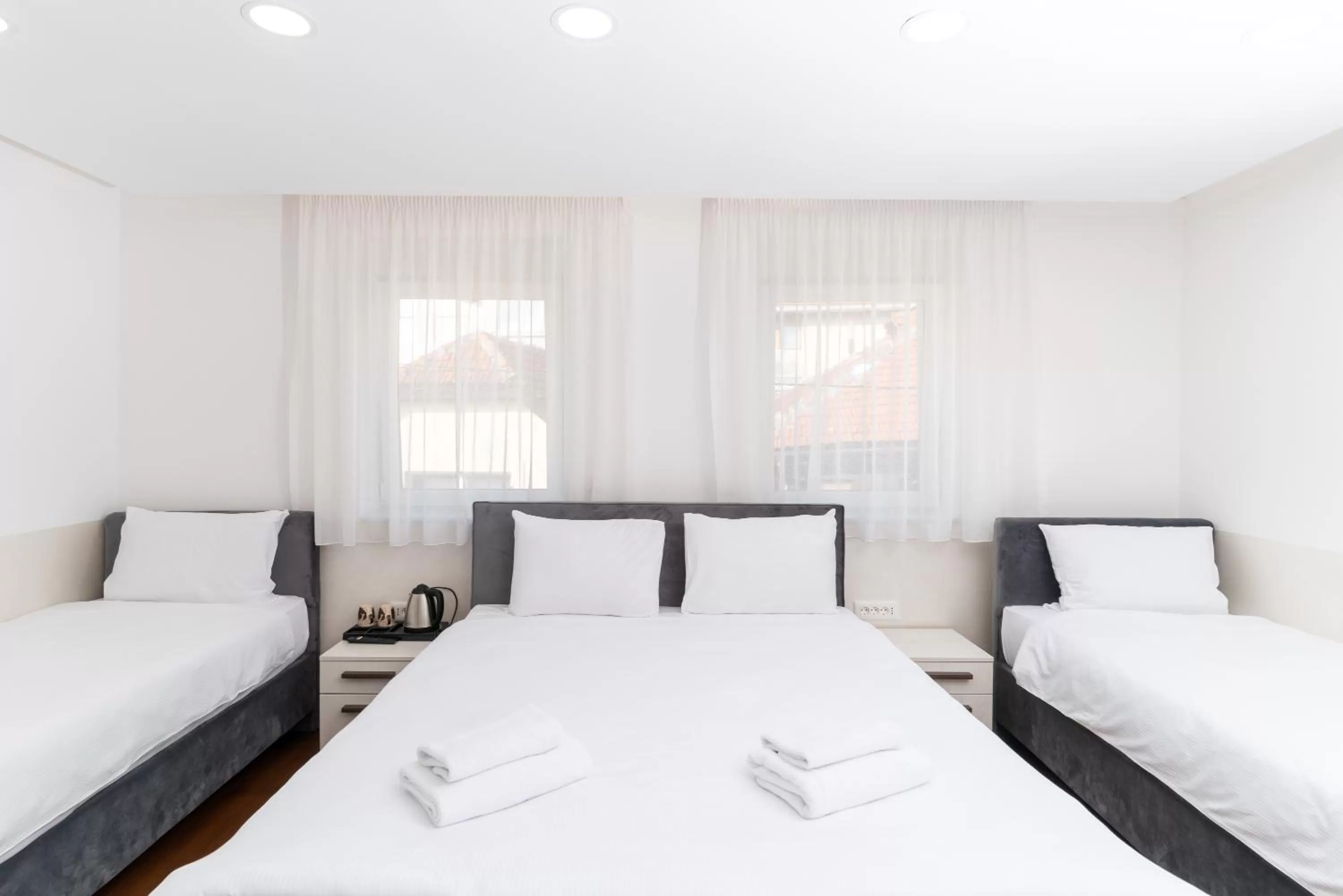 Bed in Ornament Hotel and Apartments