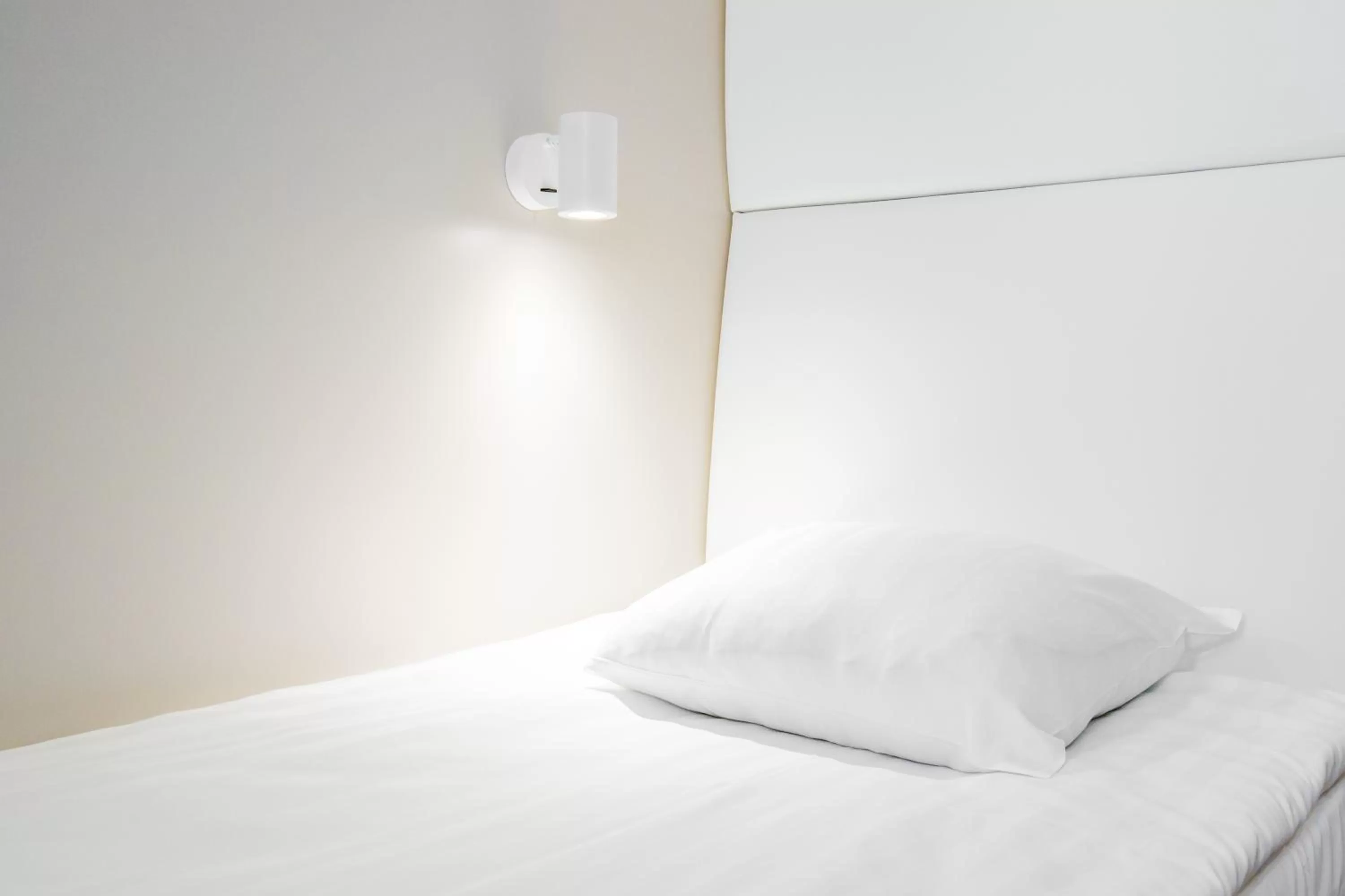 Bed in Omena Hotel Helsinki Lönnrotinkatu