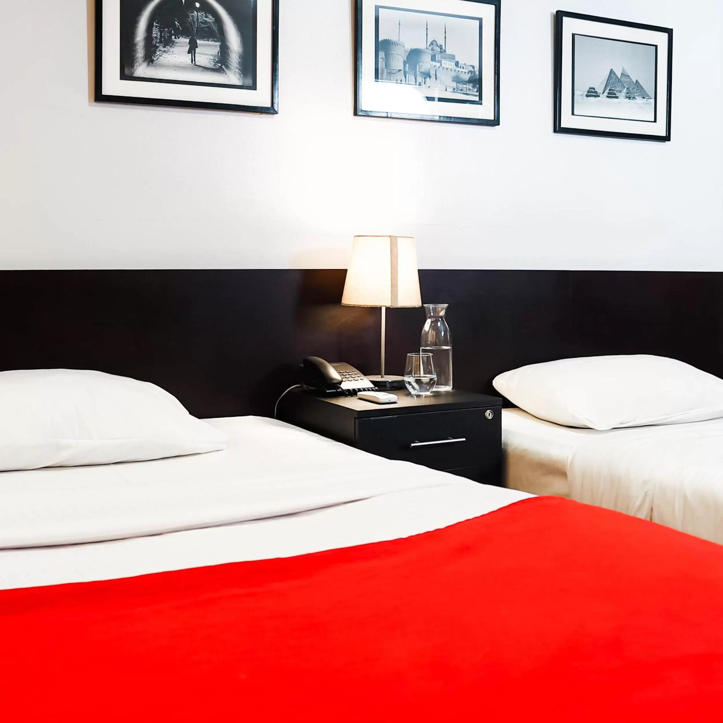 Bed in NewCity Hotel & Suites