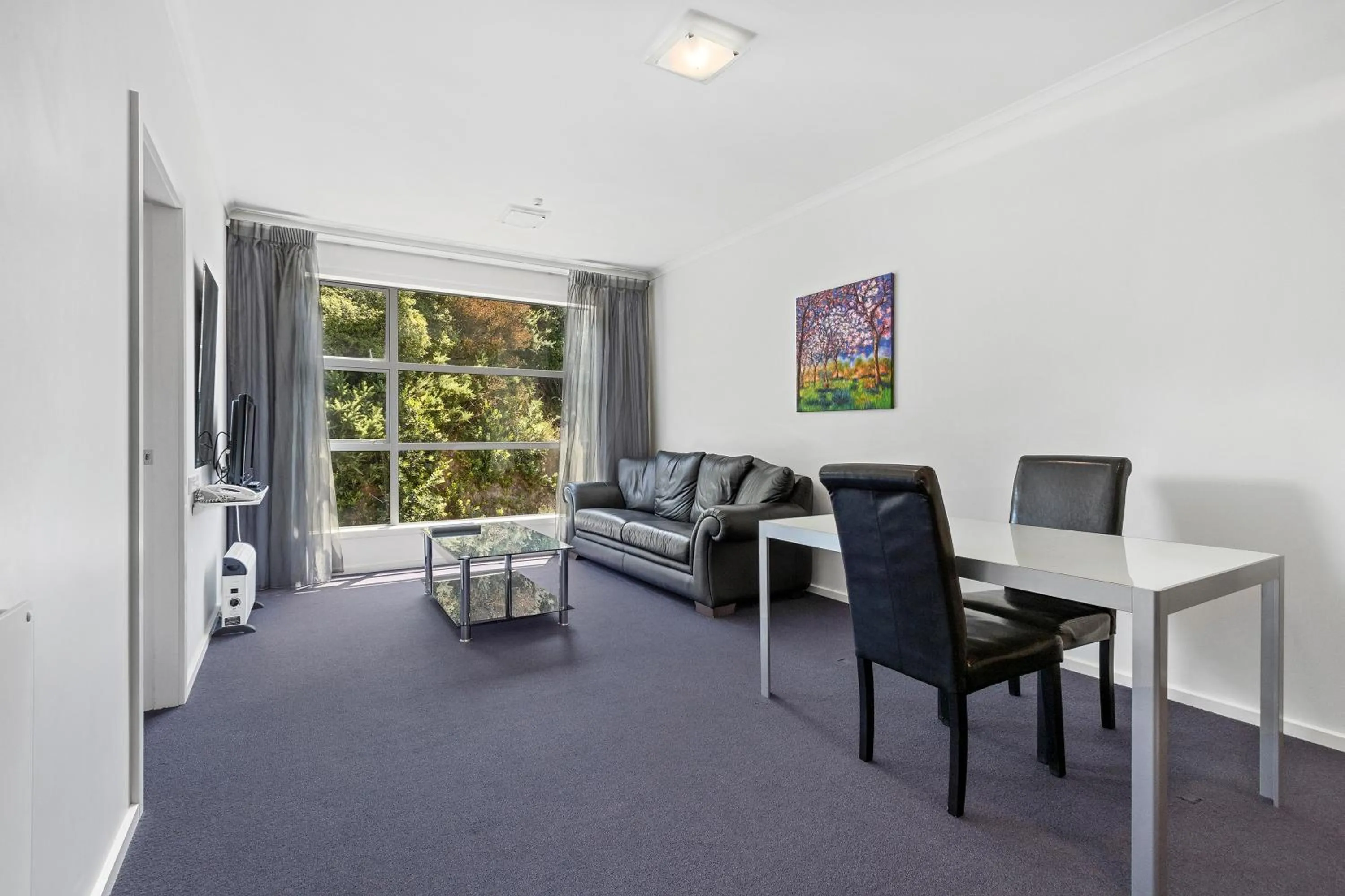 Seating area in Amethyst Court Motor Lodge