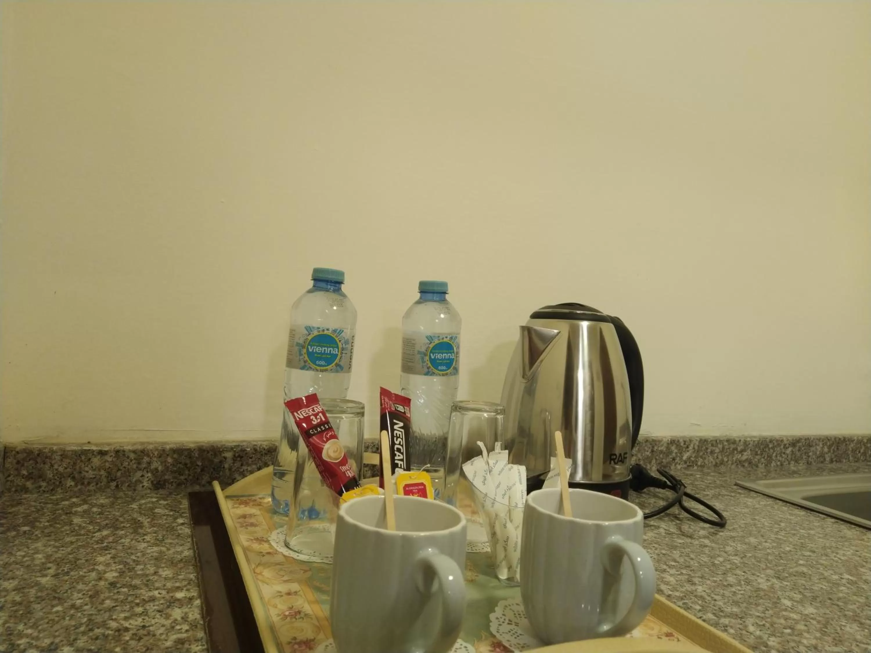 Kitchen or kitchenette in Rayan Hotel Suites