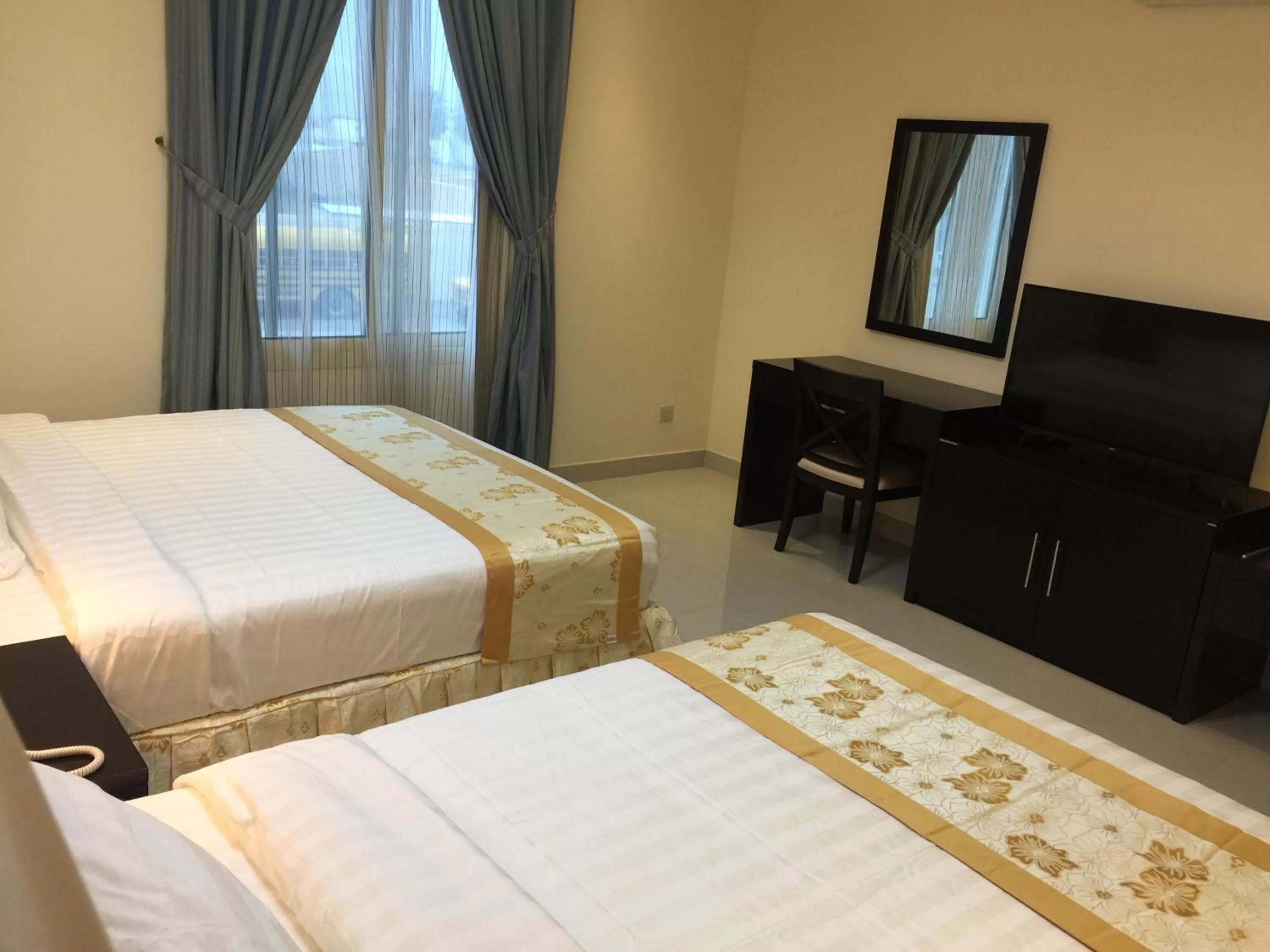 Bed in Arjaan Altakhassusi Hotel Suites