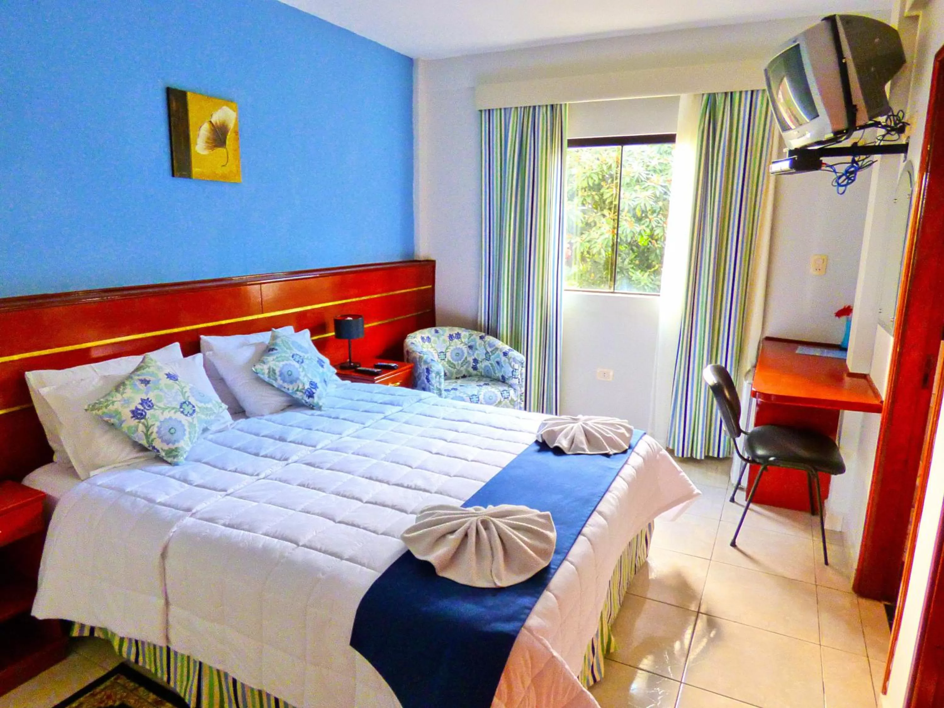 Bed in De La Costa Hotel