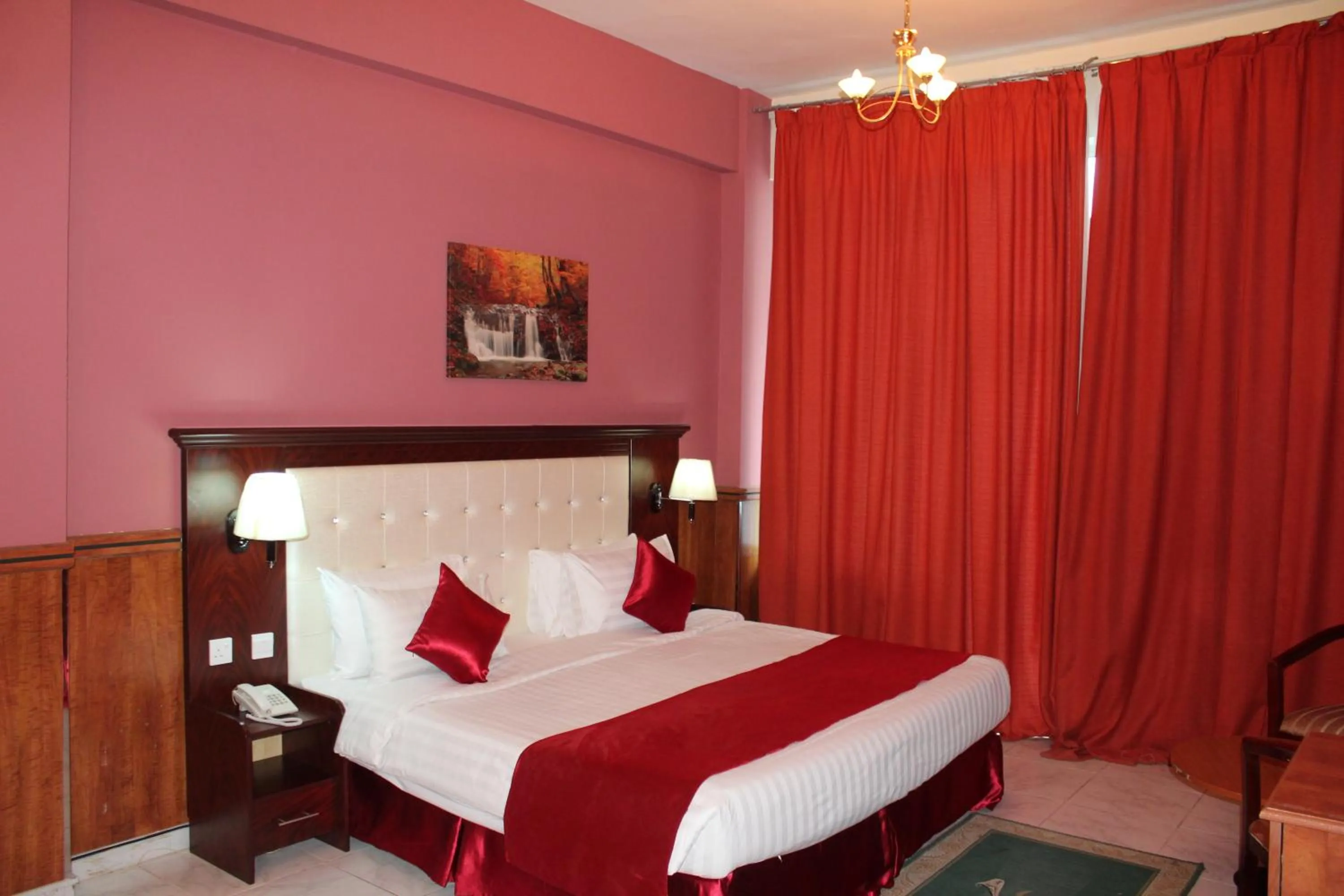 Bed in Grand Nova Hotel