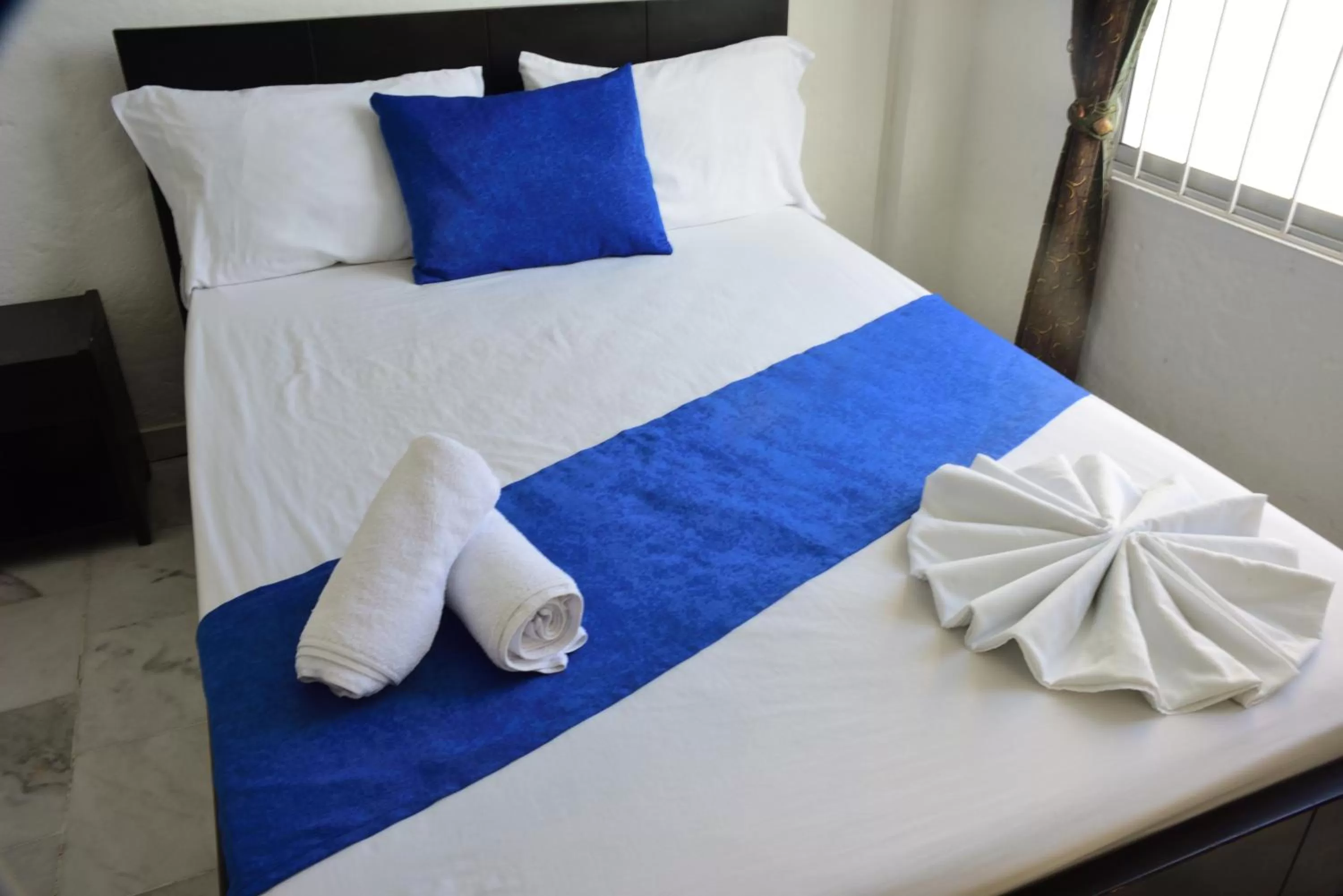 Bed in Blue Star Hotel