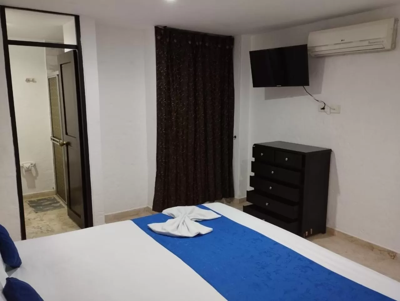 Bed in Blue Star Hotel