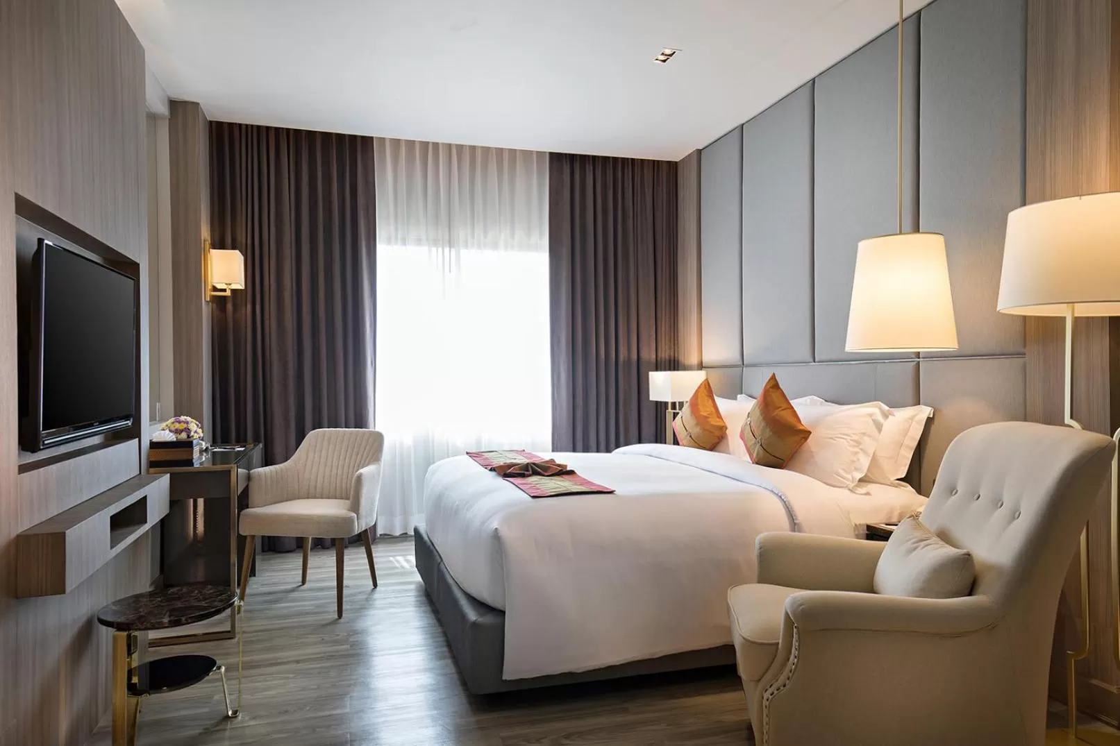 Bed in The Heritage Chiang Rai Hotel and Convention