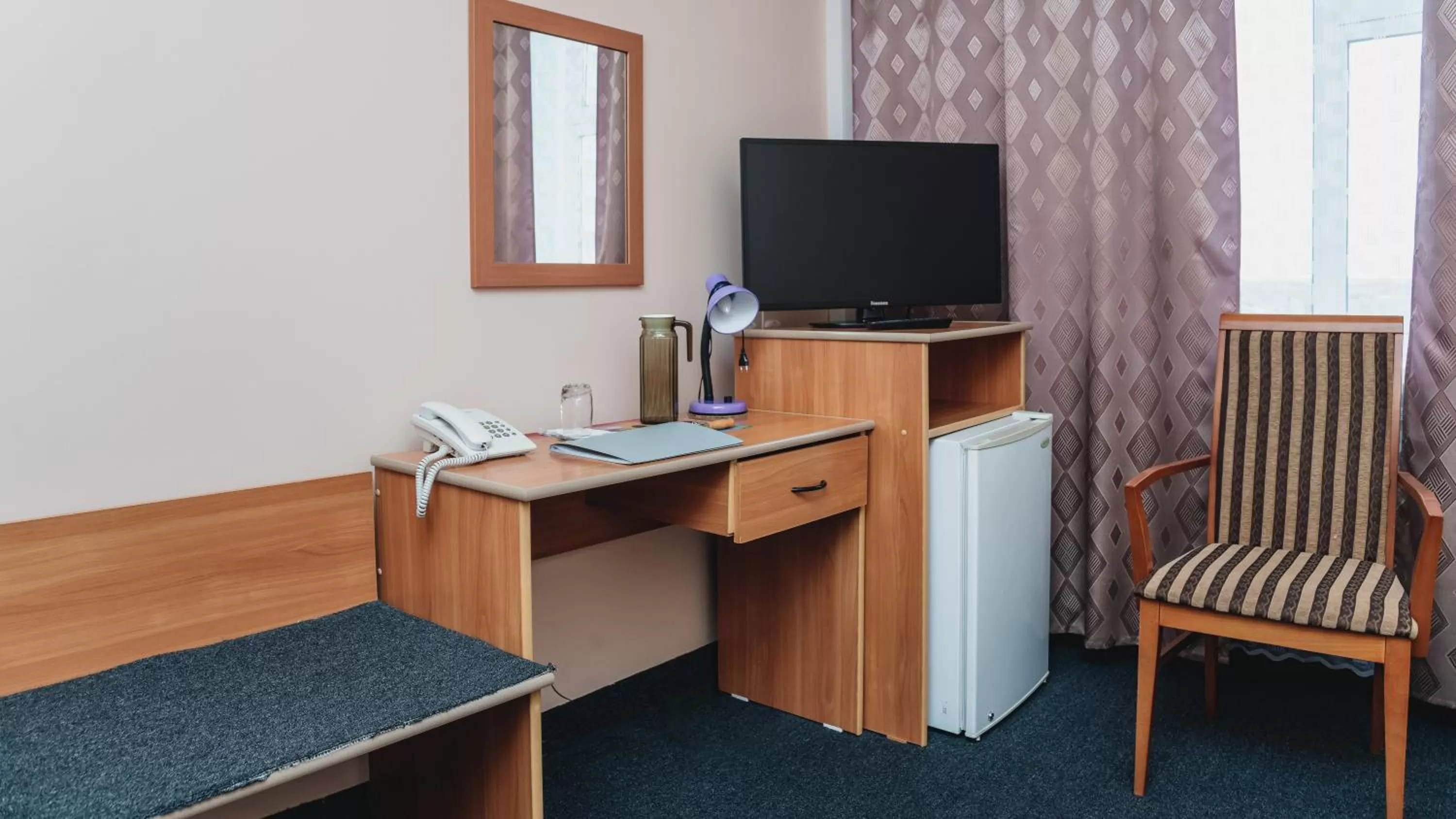 Seating area, TV/Entertainment Center in Aktobe Hotel