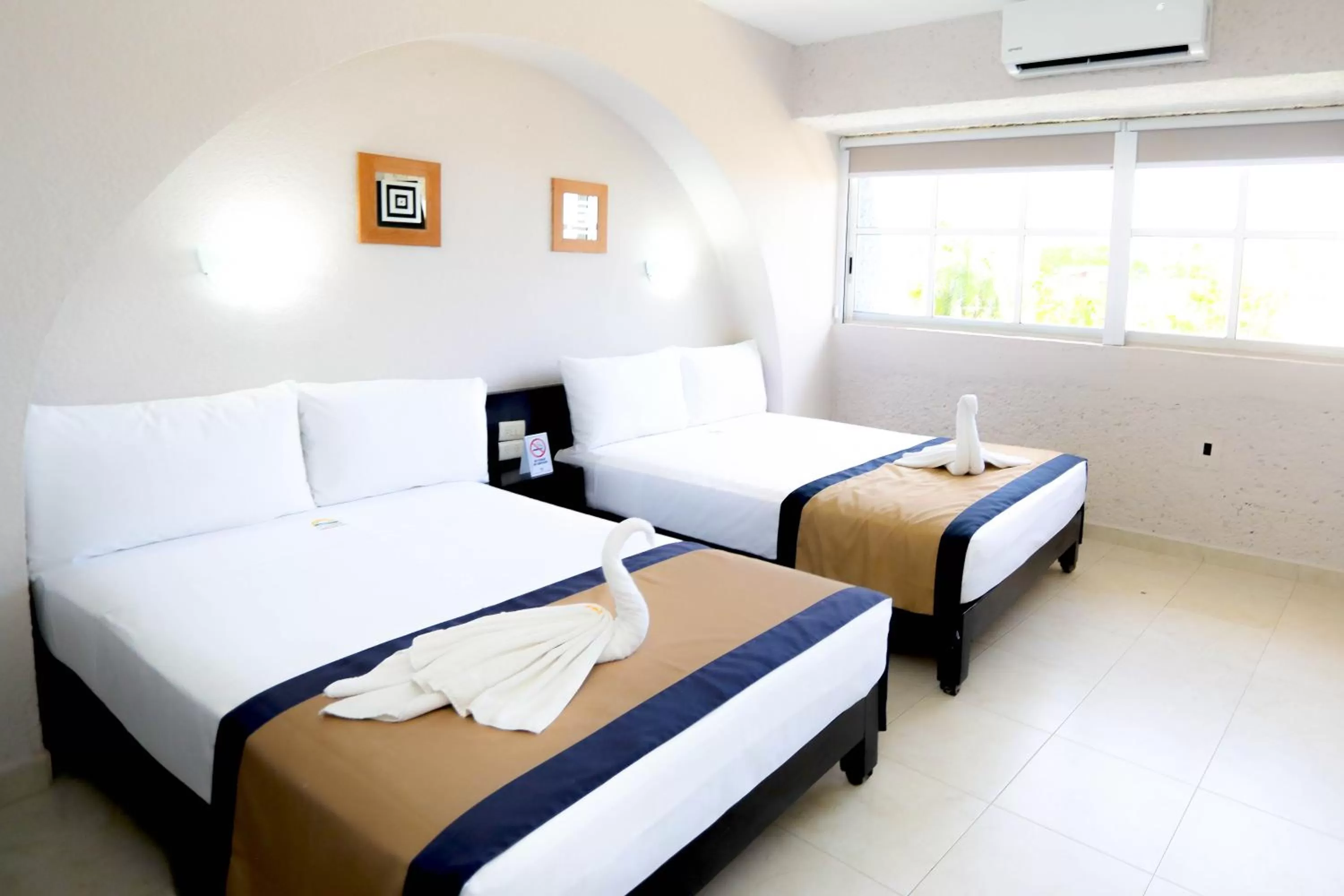 Bed in Hotel Caribe Internacional Cancun