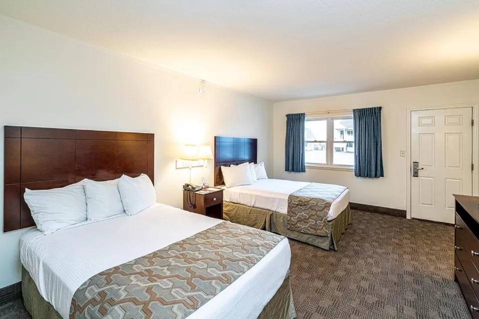 Bed in Anchorage Motel Inc.